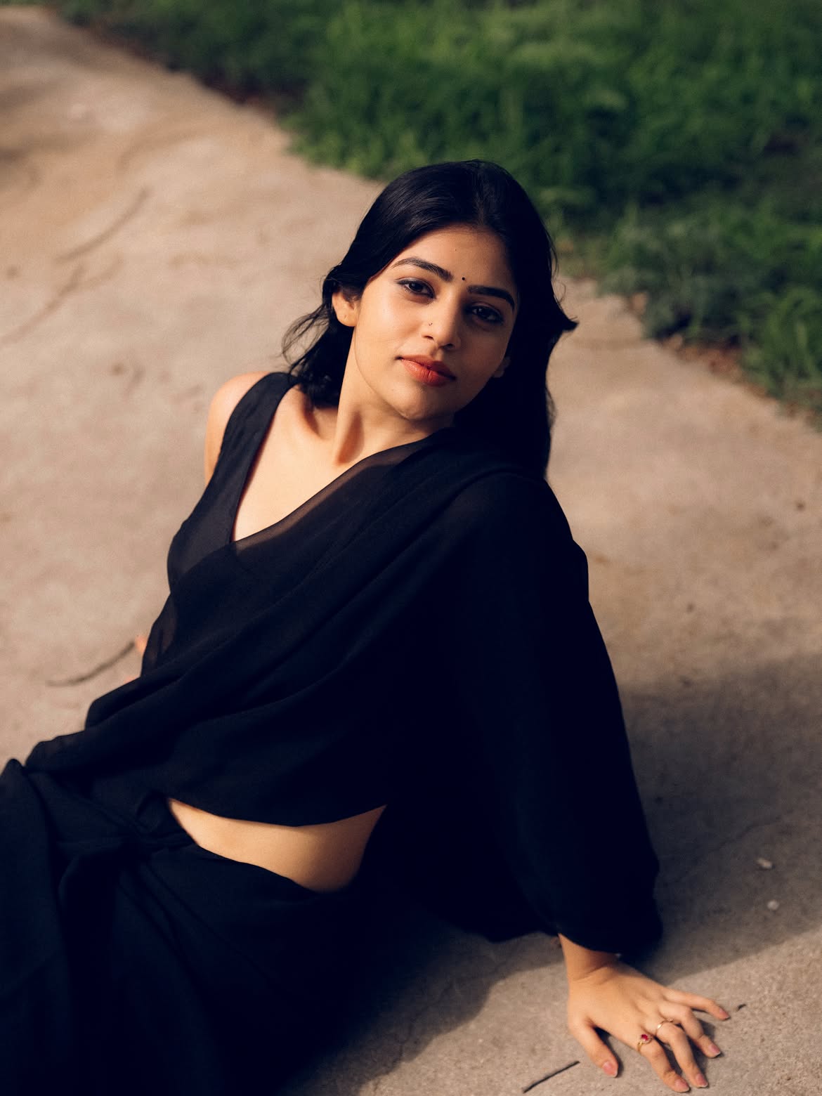 Bandhavi Sridhar Sitting On Concrete Floor Posing