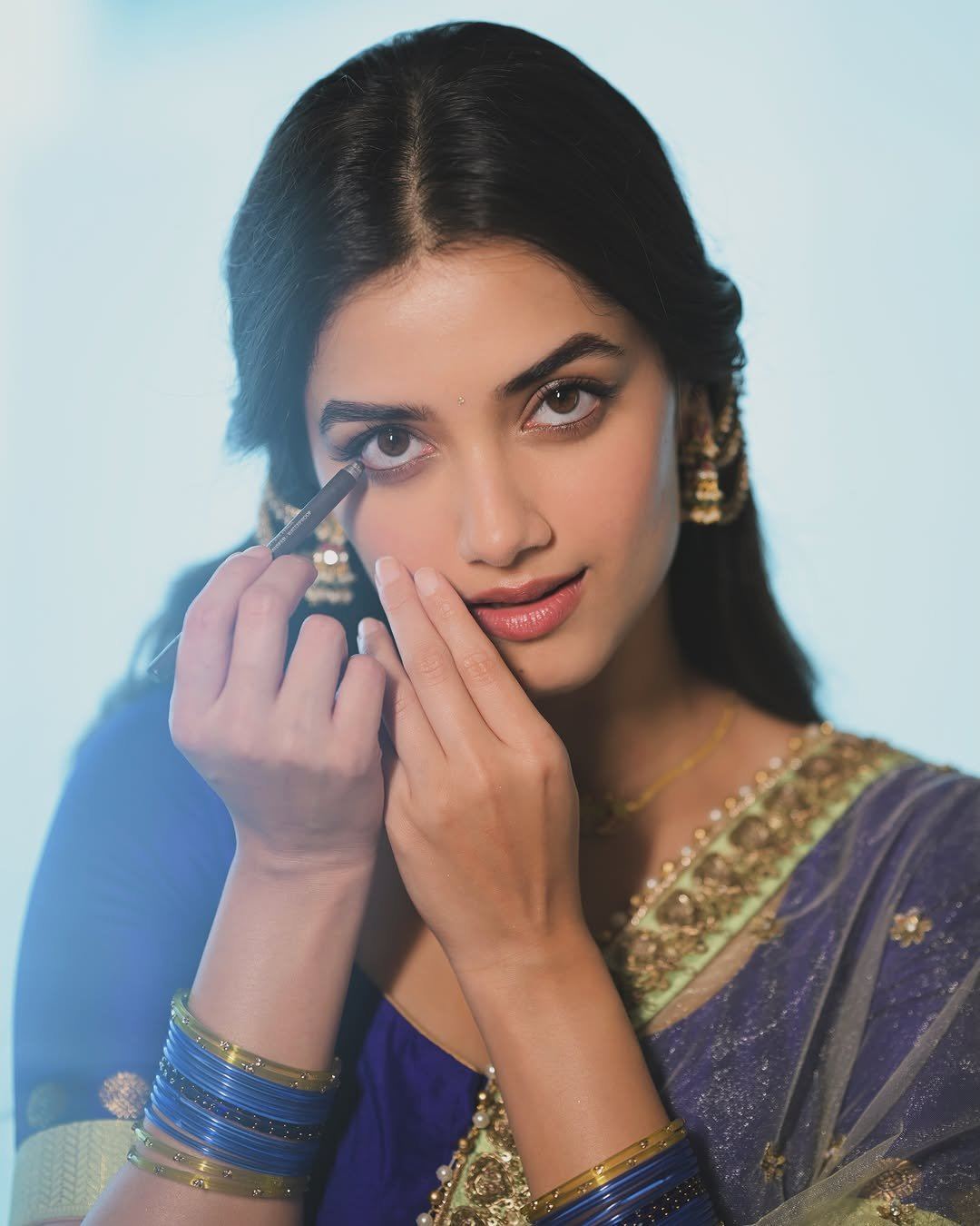 Bhagyashri Borse Applying Kajal To Lower Eyelid