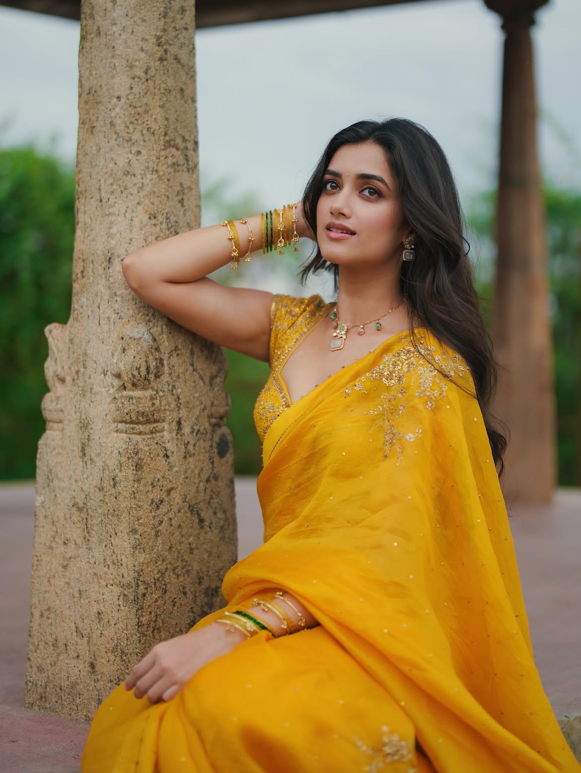 Bhagyashri Borse Posing By A Stone Pillar