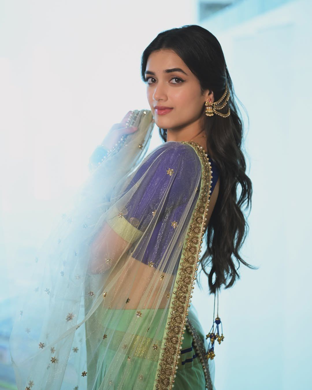 Bhagyashri Borse Striking Playful Side Angle Smile