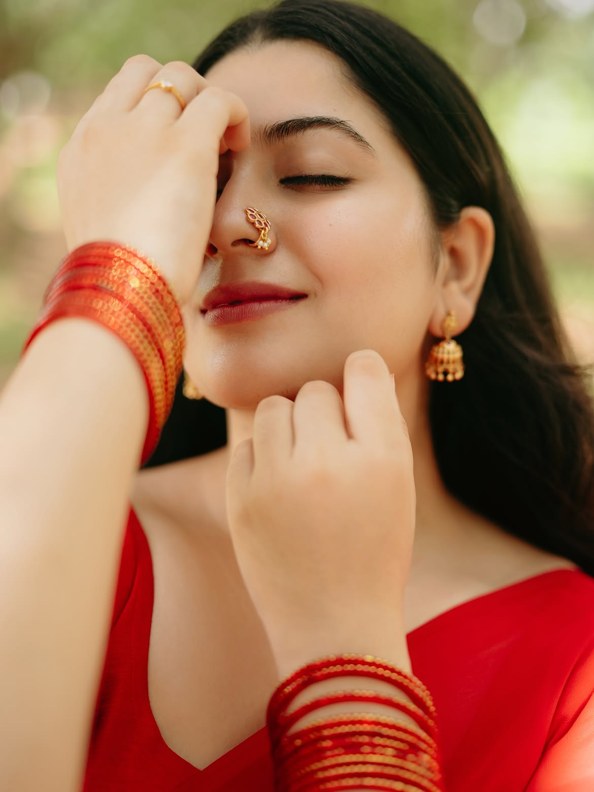 K Sudha Posing Elegantly Close Up In Red Saree
