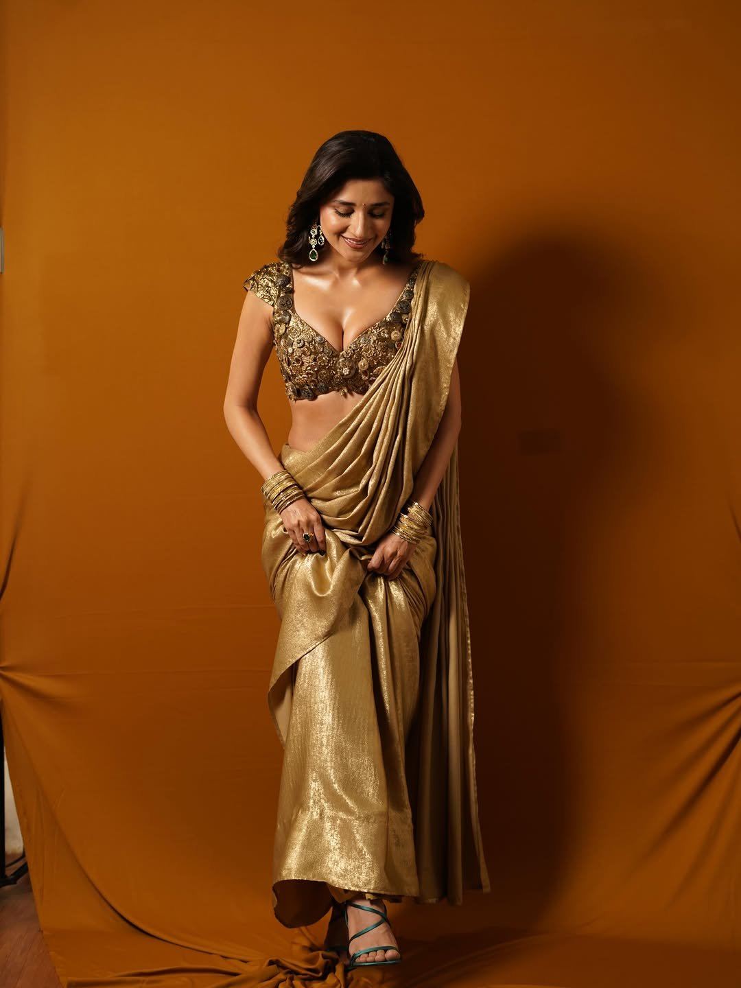 Kanika Mann Posing Confidently In Golden Saree