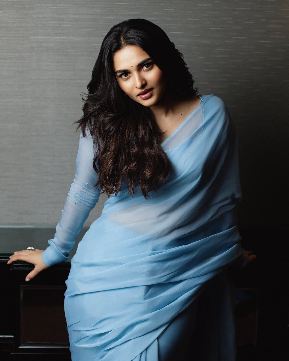 Kayadu Lohar Posing Gracefully Near Dark Accent Wall