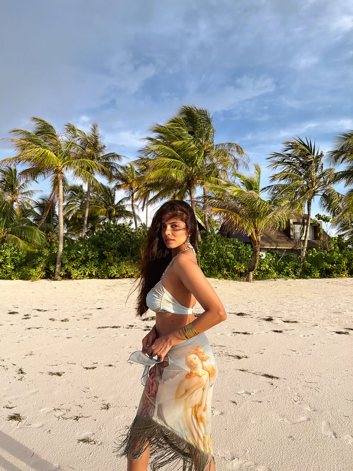 Malavika Mohanan Elegant Ocean Back Pose Style