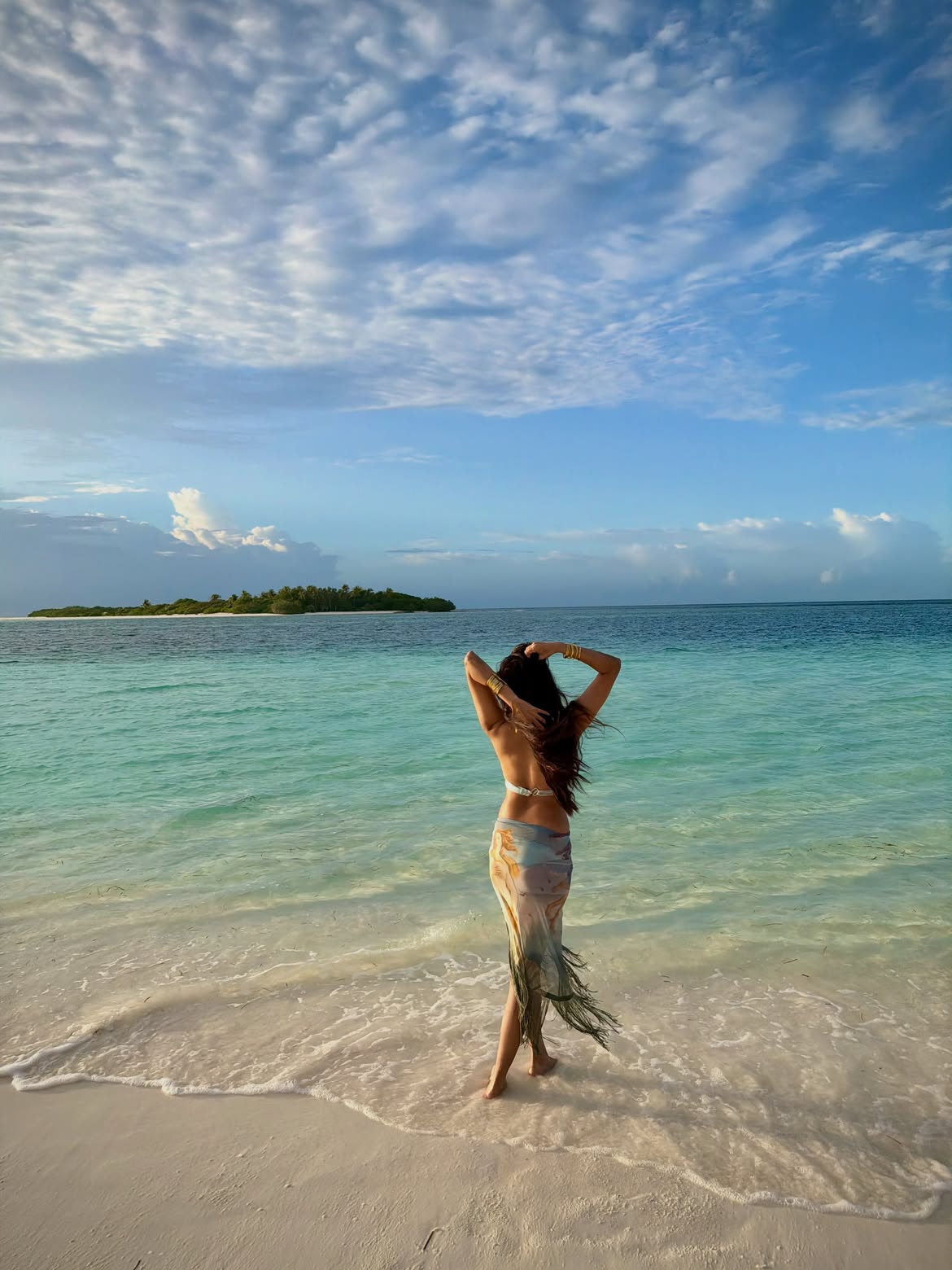 Malavika Mohanan Walking Along Blue Beach Shore