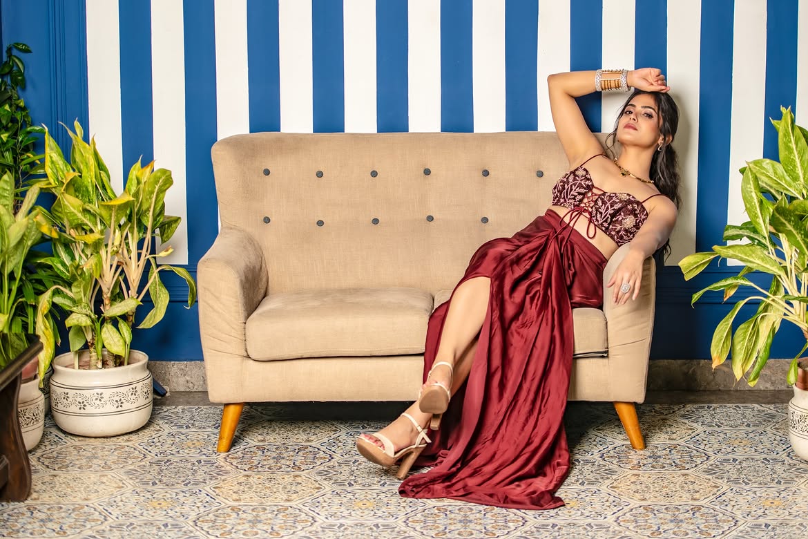 Naina Ganguly Leaning Back On Plush Beige Couch