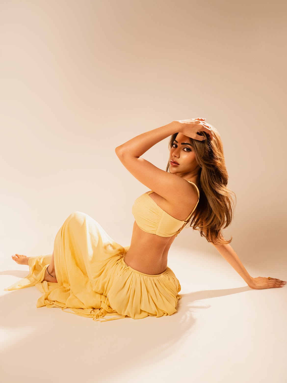 Nikki Tamboli In Pastel Yellow Top And Flowy Skirt