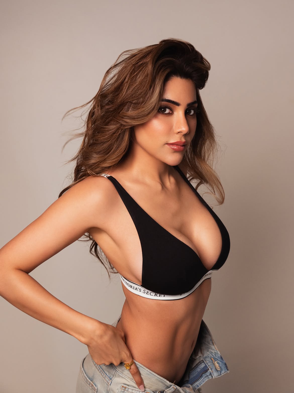 Nikki Tamboli Standing Boldly In Black Bralette