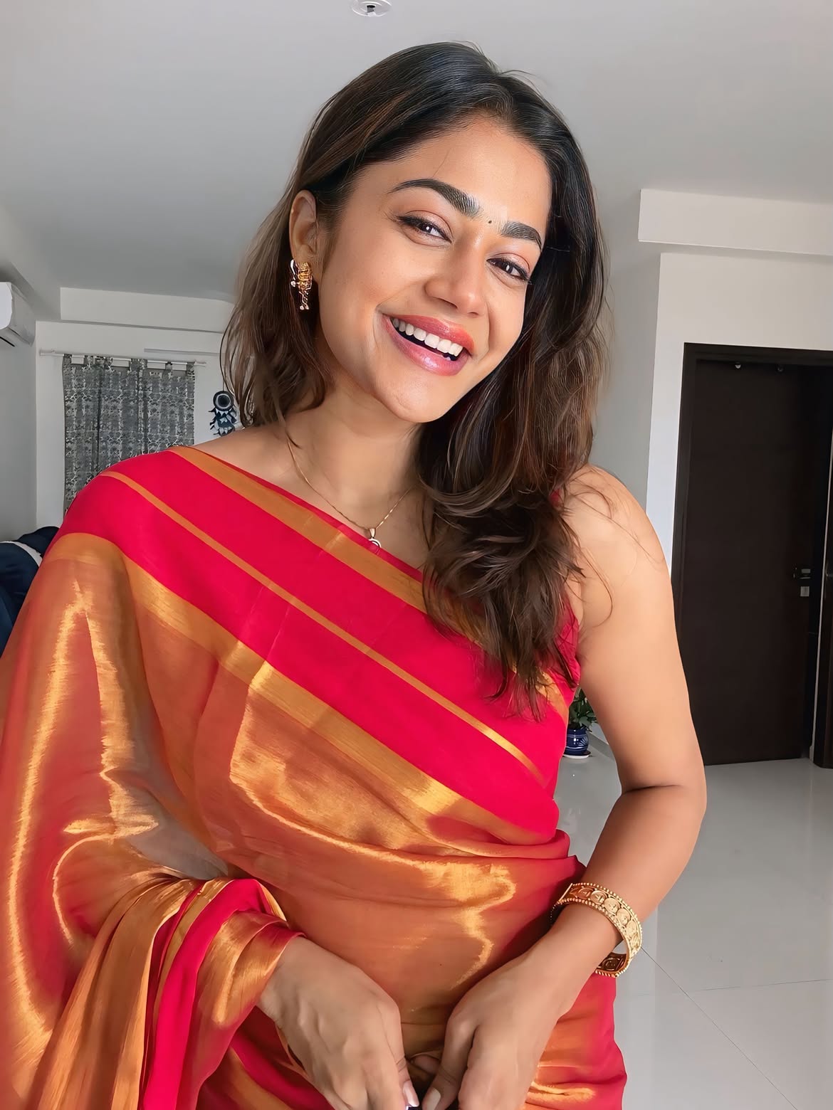 Payal Radhakrishna Posing Joyfully In Red Silk Saree
