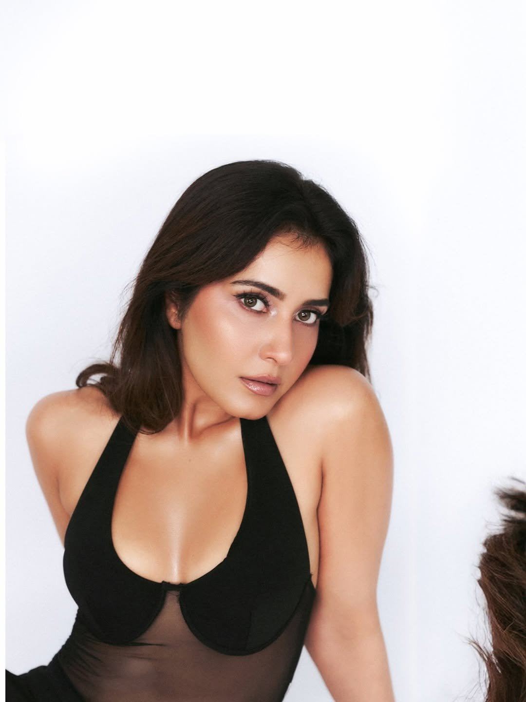Raashii Khanna Poses In Chic Sheer Black Top
