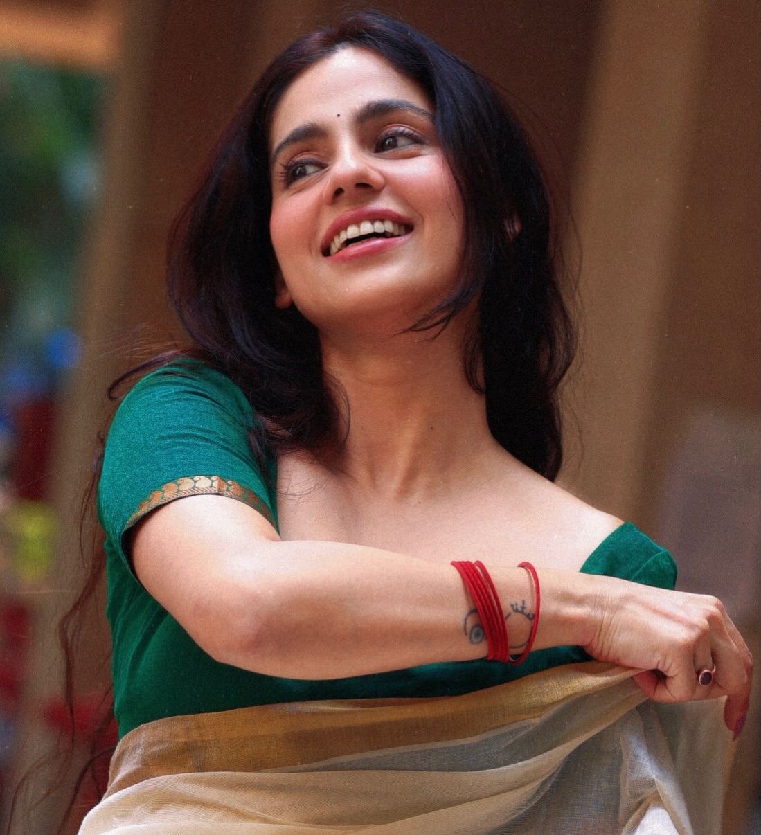 Rose Sardana Flaunting Red Glass Bangles On Wrist