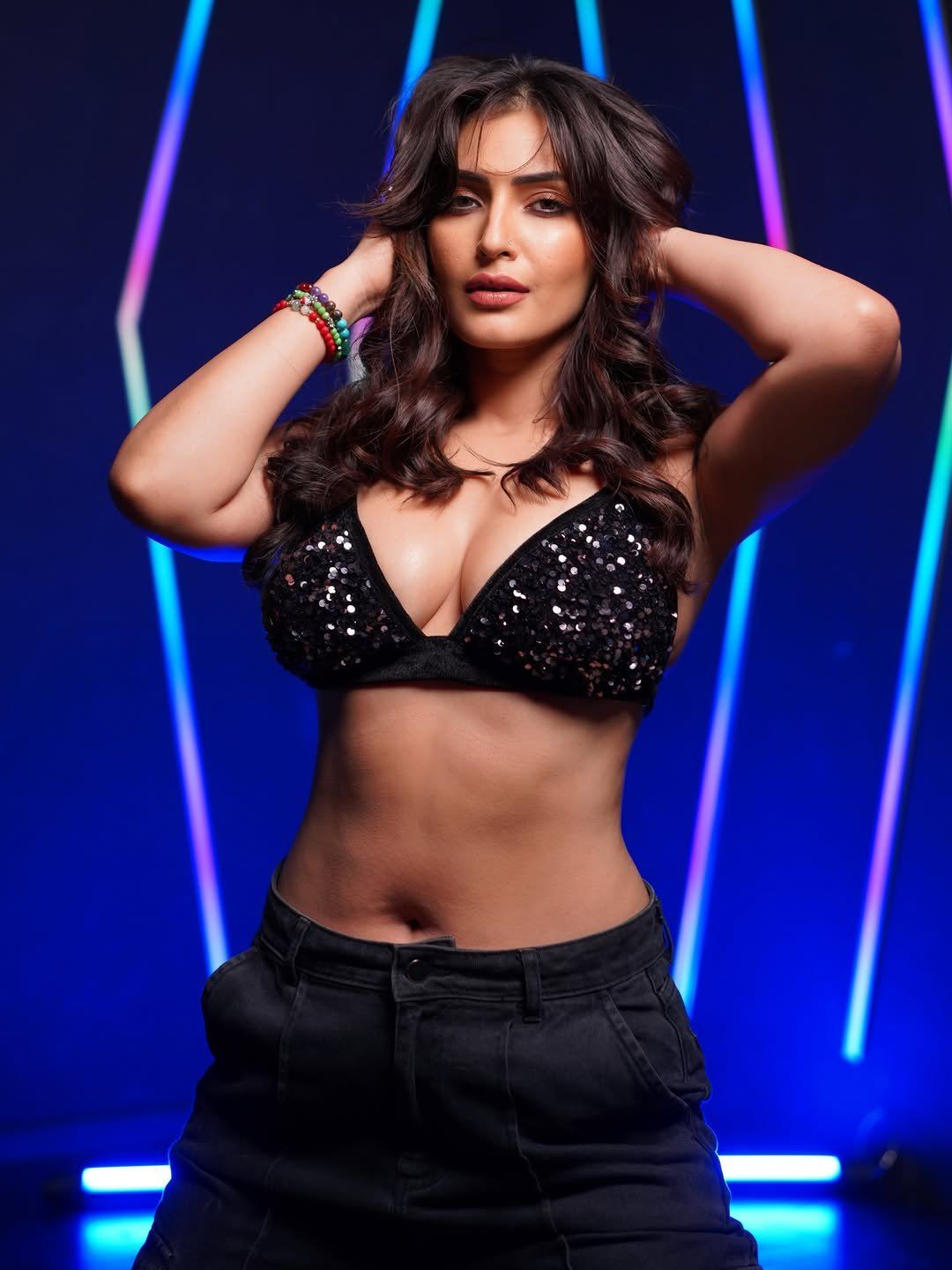 Shivangi Verma Looking Confidently Near Neon Backdrop