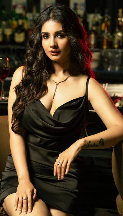 Angana Roy Poses In A Sleek Black Dress In Style