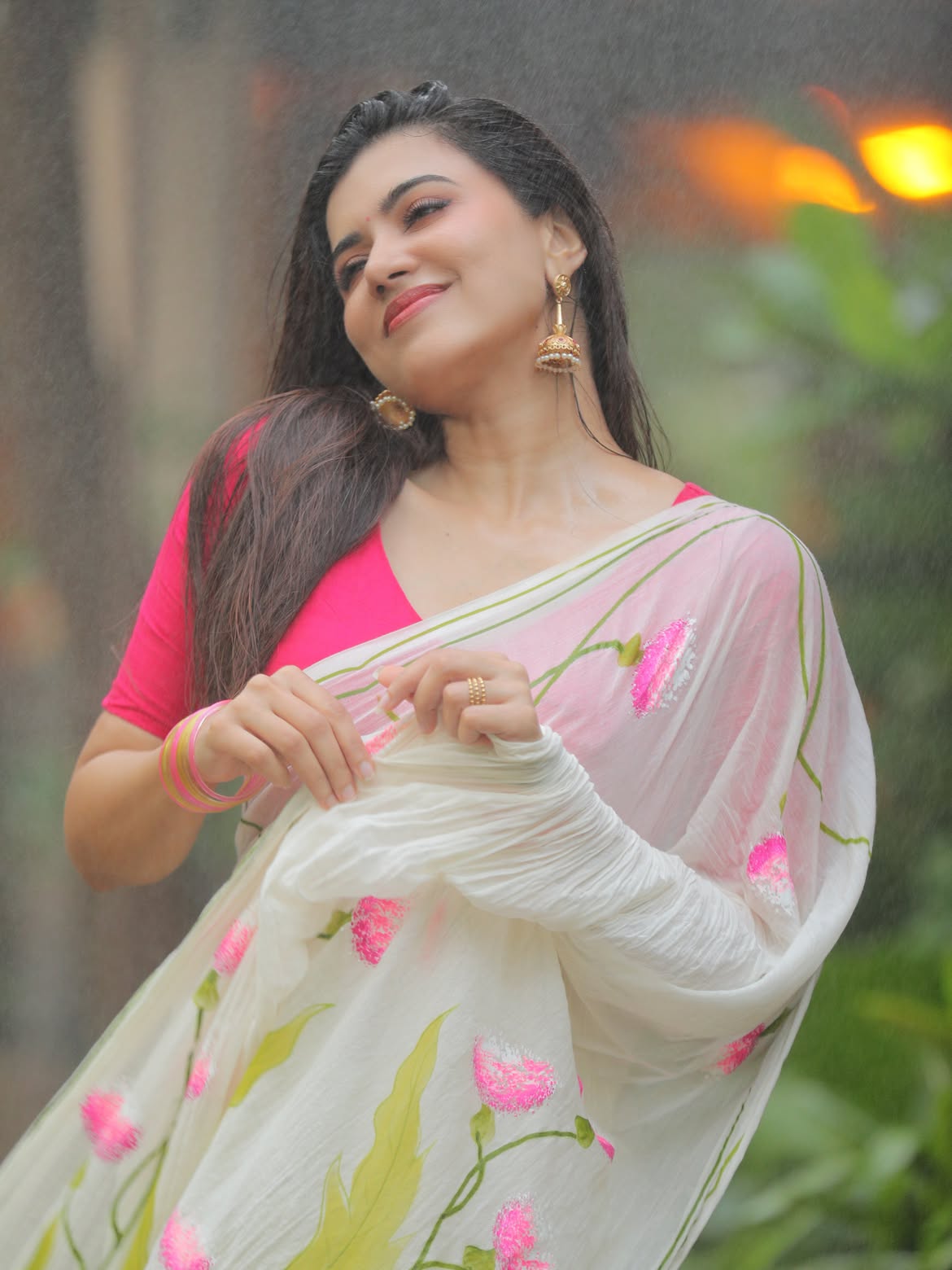 Anju Kurian Enjoys Rain With Bright Pink Blouse