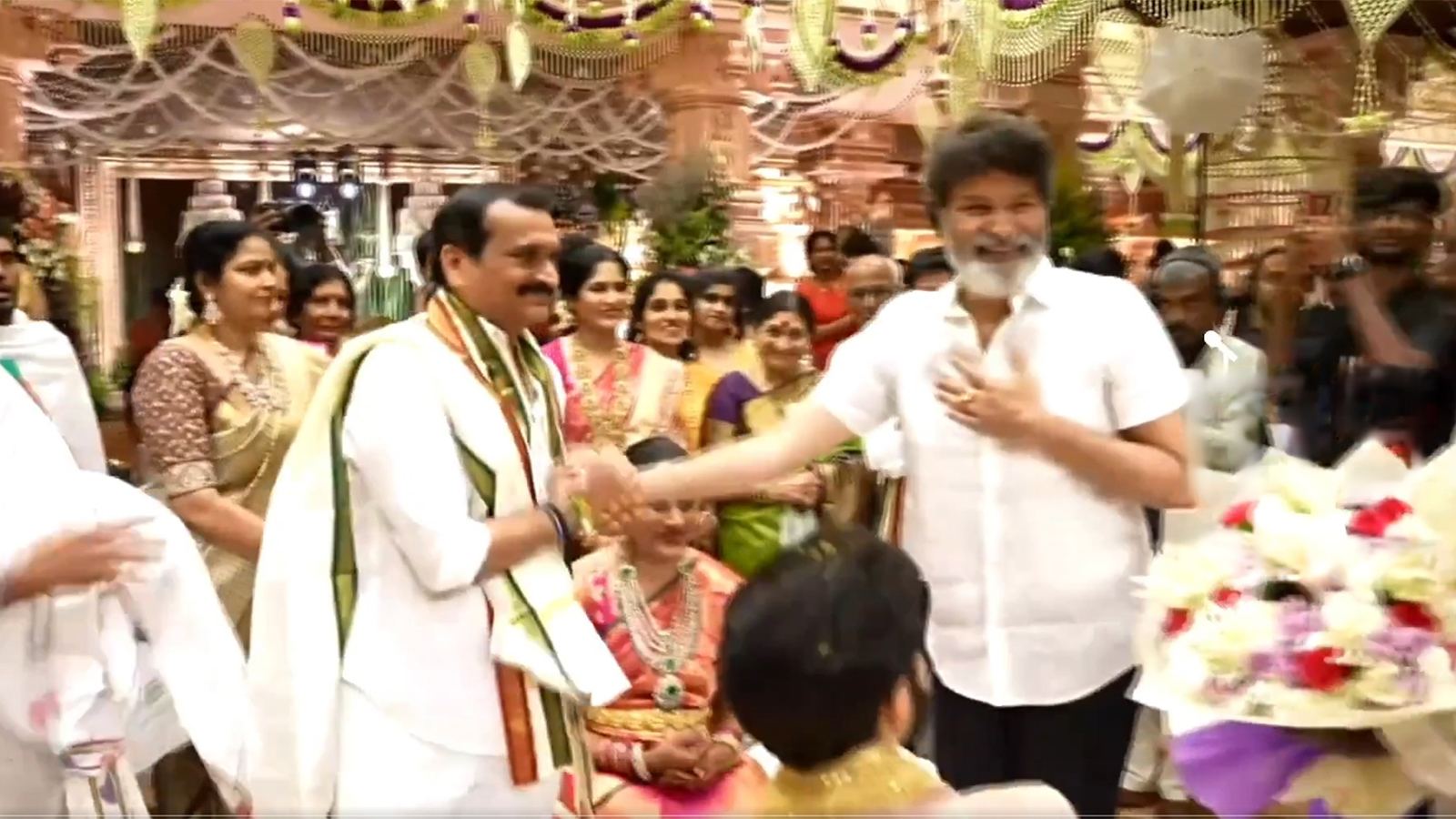 Bandla Ganesh greets Trivikram at wedding