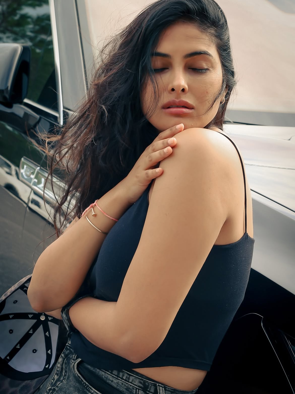 Divi Vadthya Relaxed Pose In Black Tank And Denim