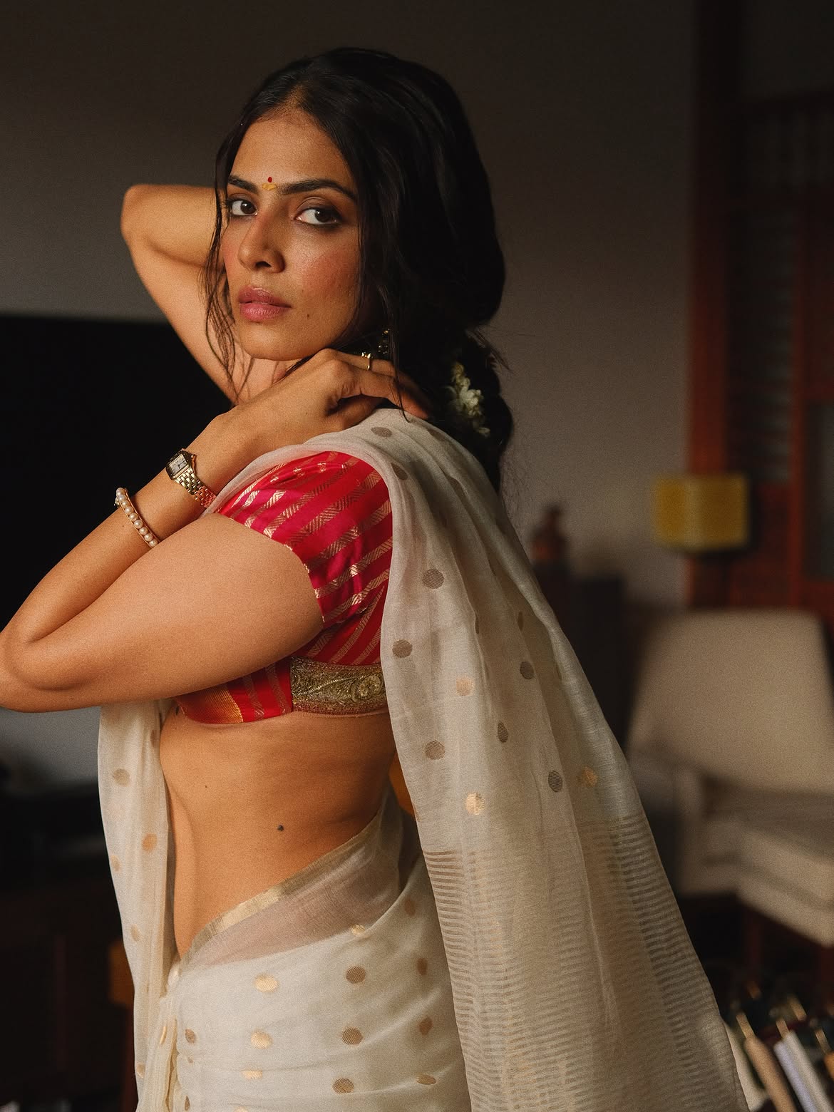 Malavika Mohanan Graceful Floral Floor Pose Shot