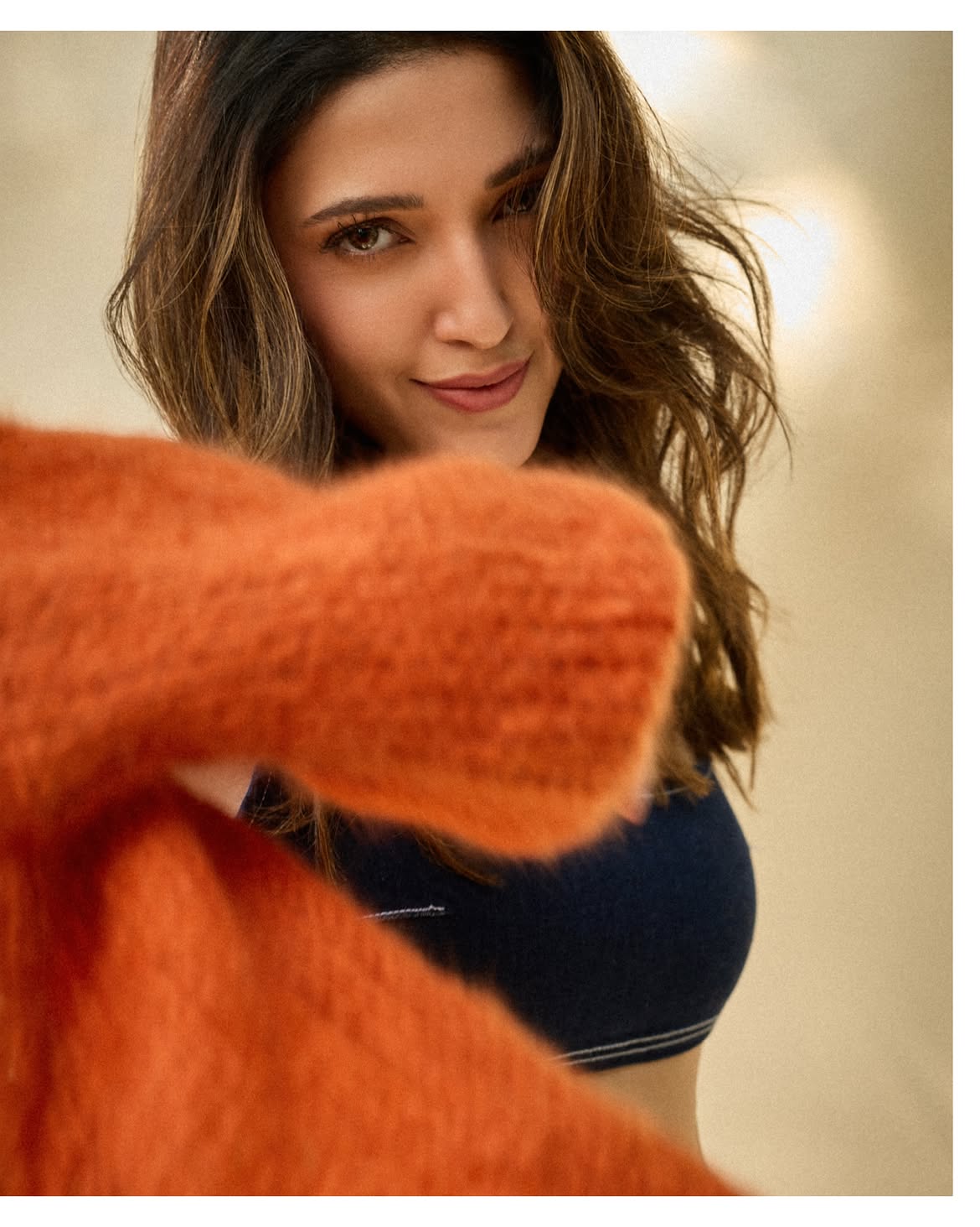Neha Shetty In Cozy Orange Knitwear Portrait Look