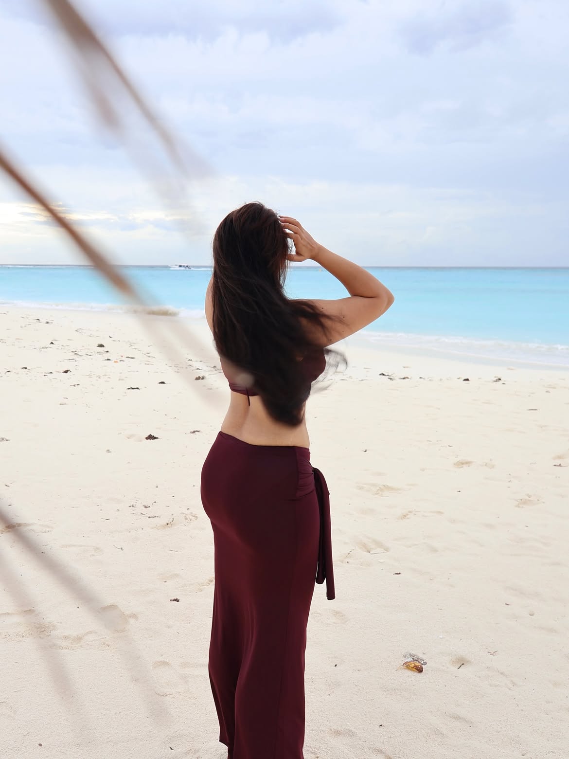 Nikita Sharma In Stylish Maroon Beach Outfit Pose