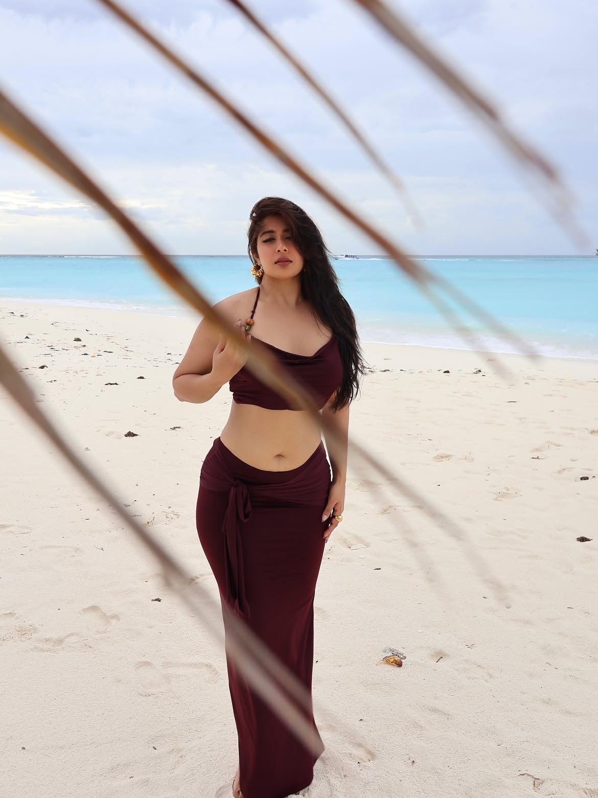 Nikita Sharma Poses Gracefully By Blue Waters