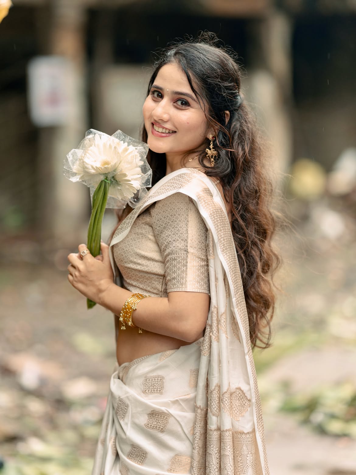 Payal Gupta Holds White Blooms With Bright Smile
