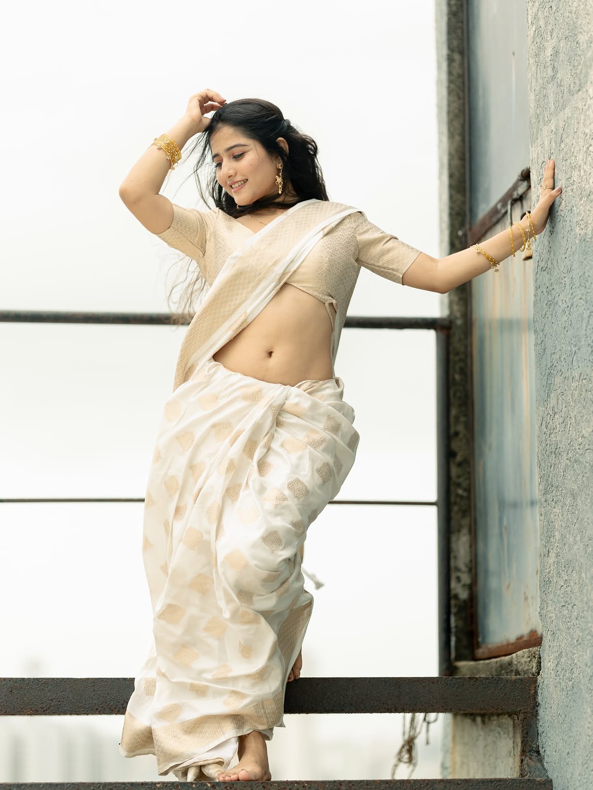 Payal Gupta Poses Gracefully On Rustic Iron Steps
