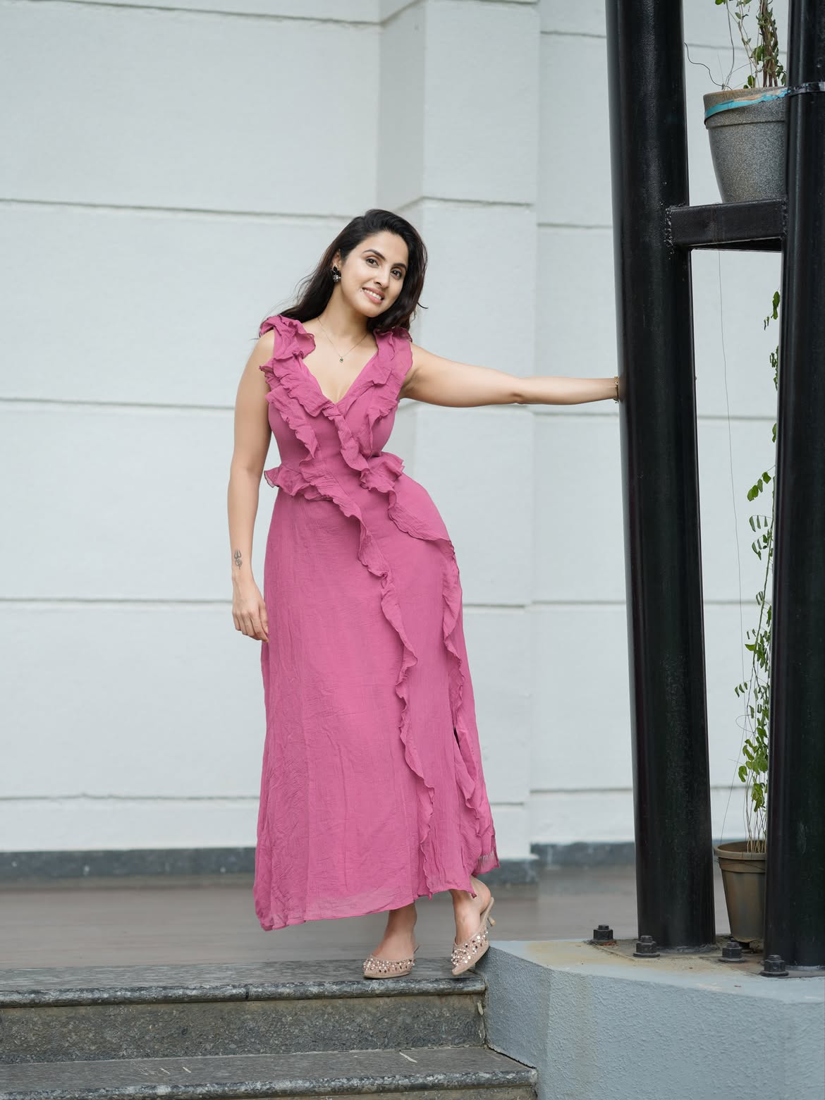 Stylish Stair Pose Wearing Flowing Pink Outfit Look