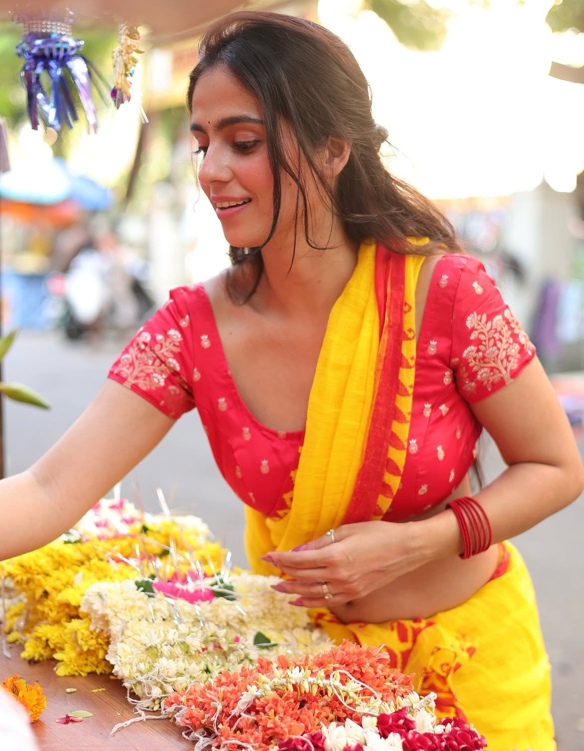 Rose Sardana Smiles While Making Flower Garlands