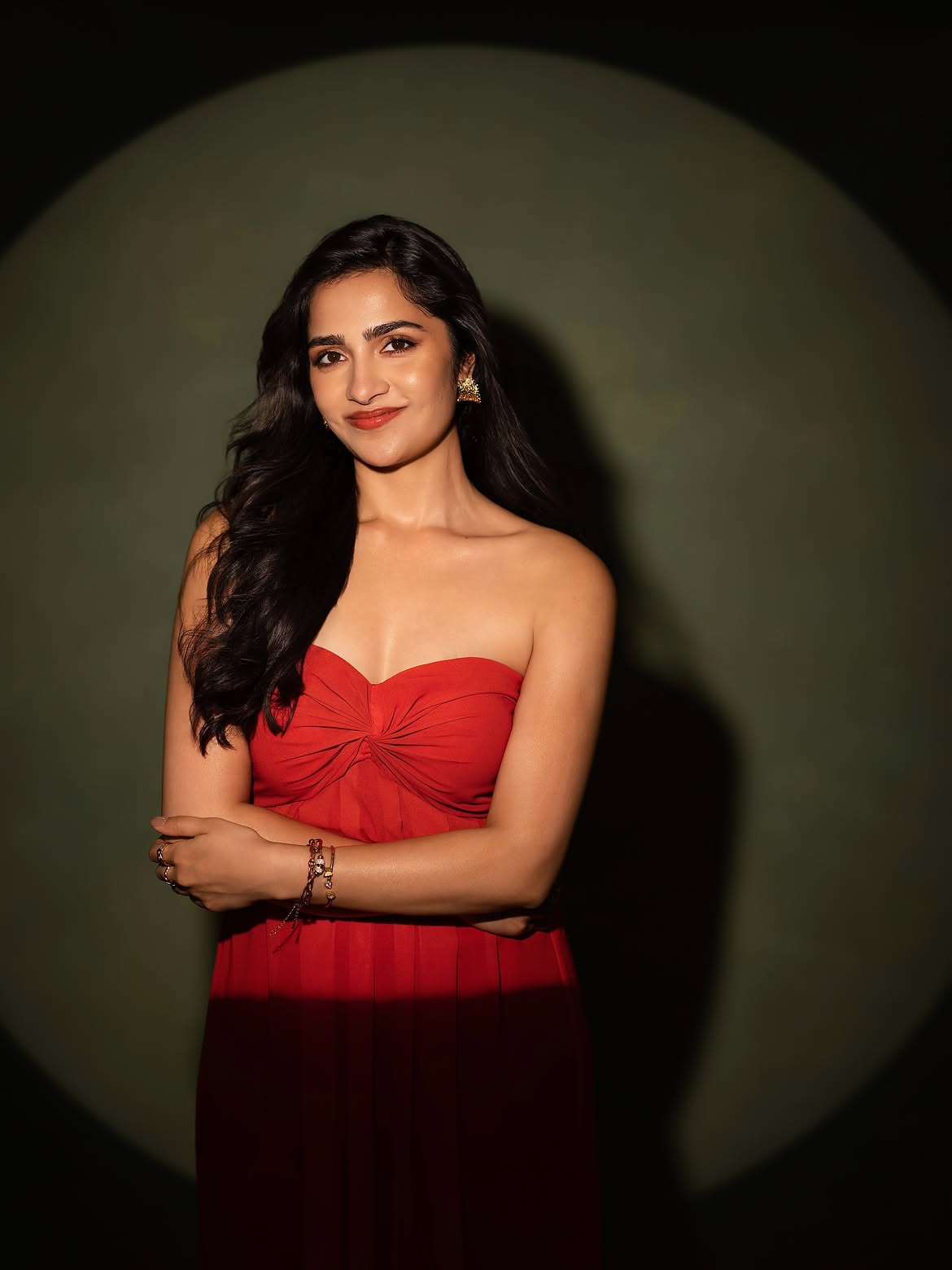 Rukmini Vasanth Smiles In Elegant Red Gown Pose