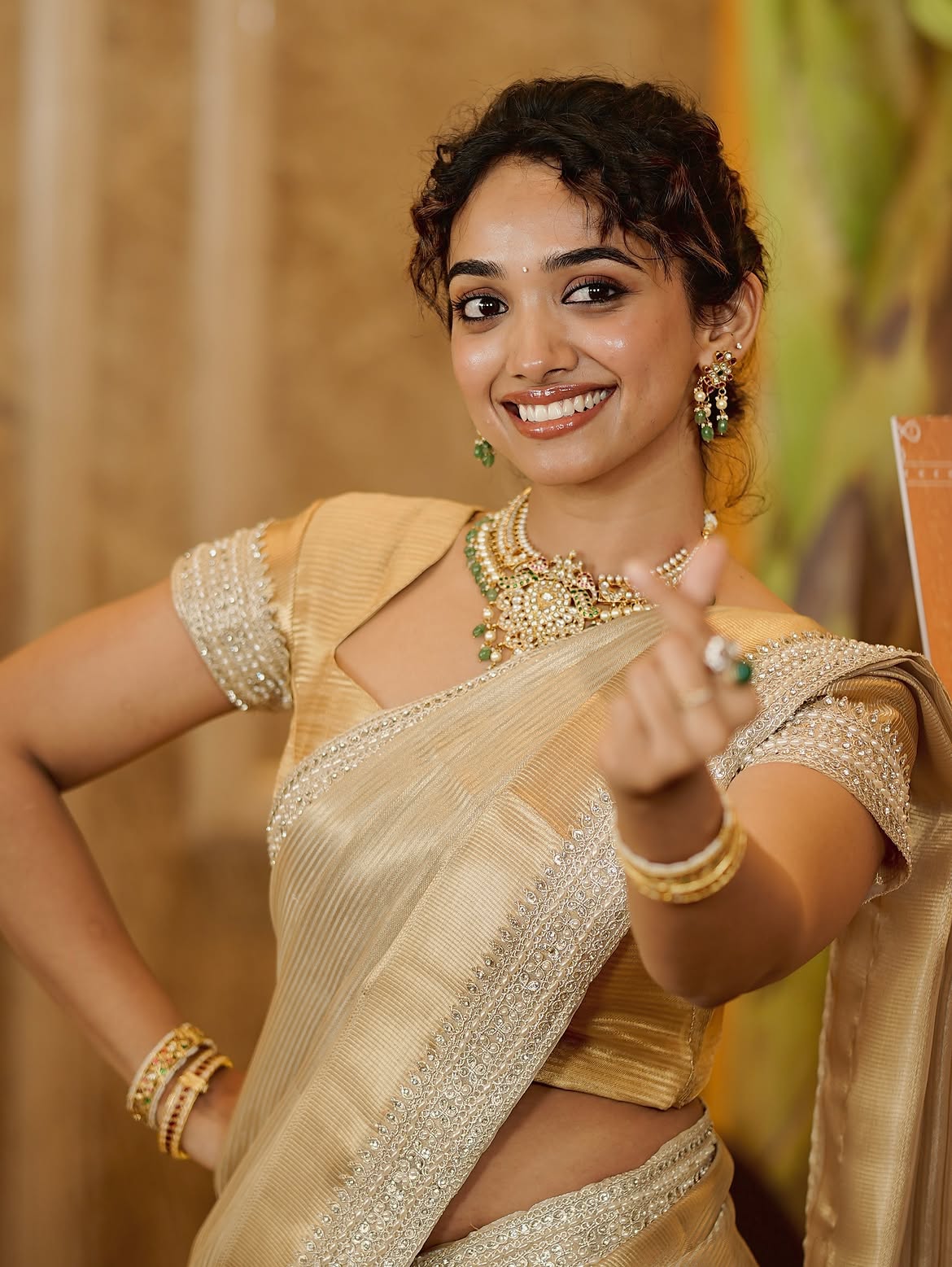 Saanve Megghana Smiles In Golden Saree Gracefully