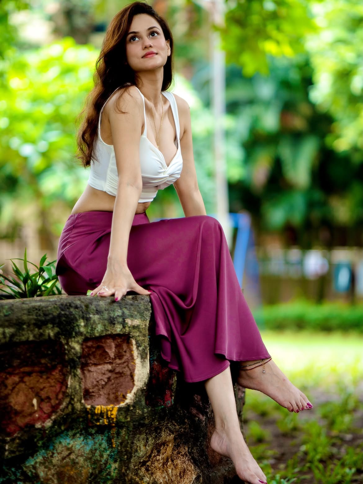 Urvashi Pardeshi Elegant Sitting Pose Outdoors