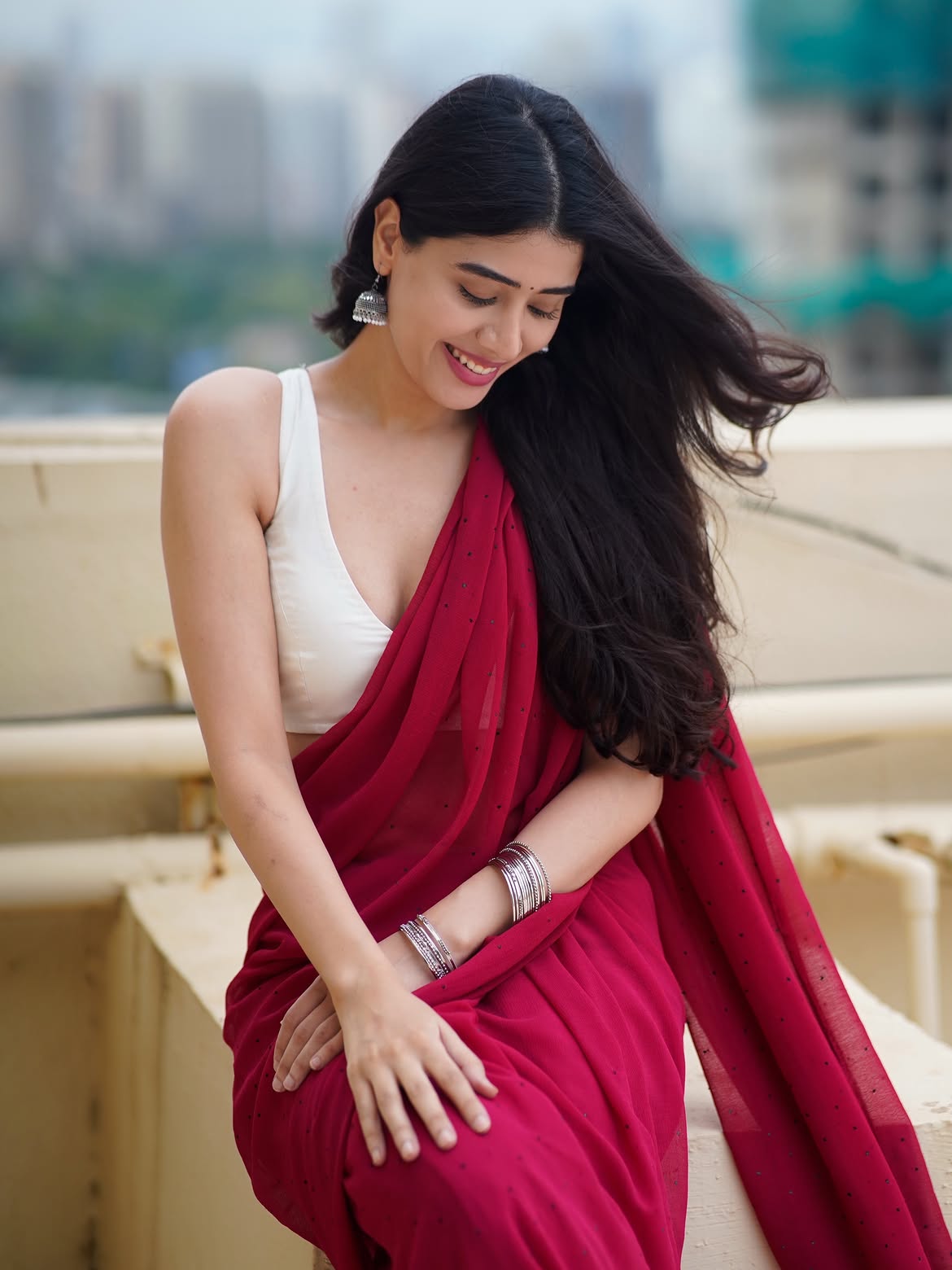 Aarti Chikara In A Deep Red Saree On The Rooftop