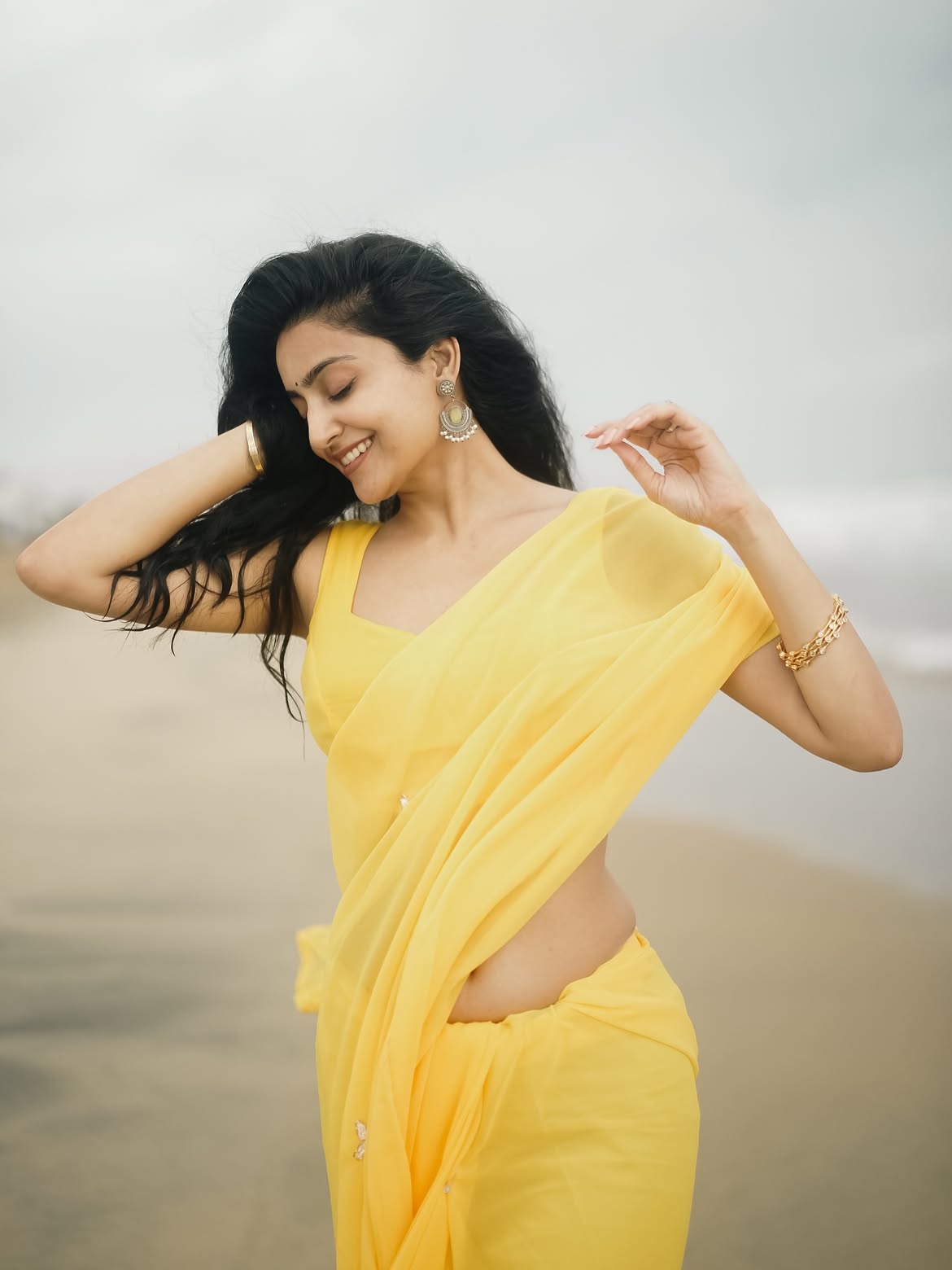 Avantika Mishra Posing In Yellow Saree On Coasts