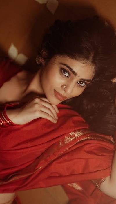 Pics: Bandhavi Sridhar Gives Soft Gaze In Red Saree
