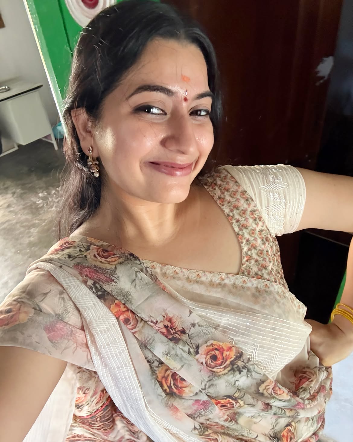 K Sudha Radiant With Bindi In Ivory Floral Saree