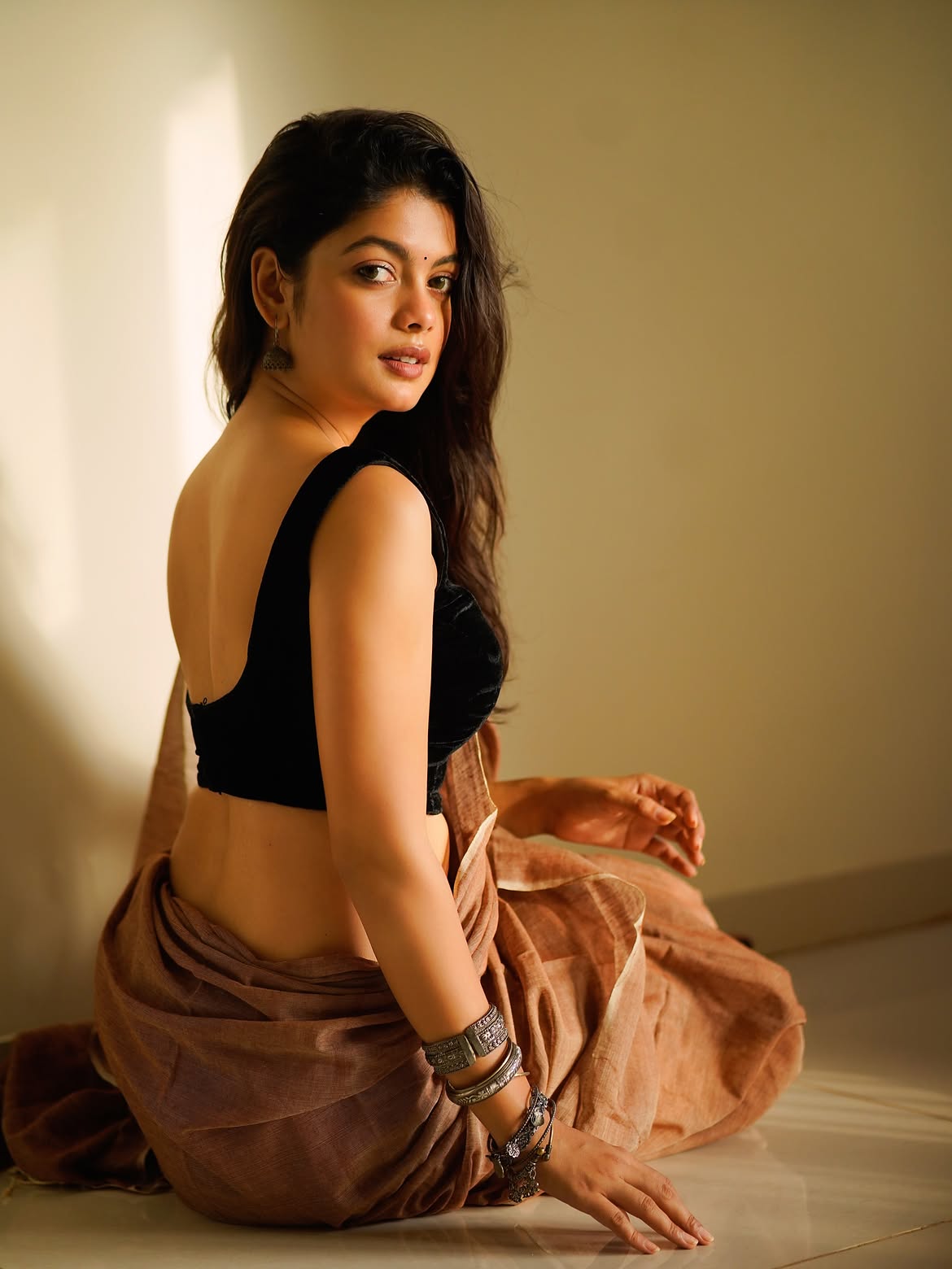 Moumita Posing In A Sultry Black Backless Blouse