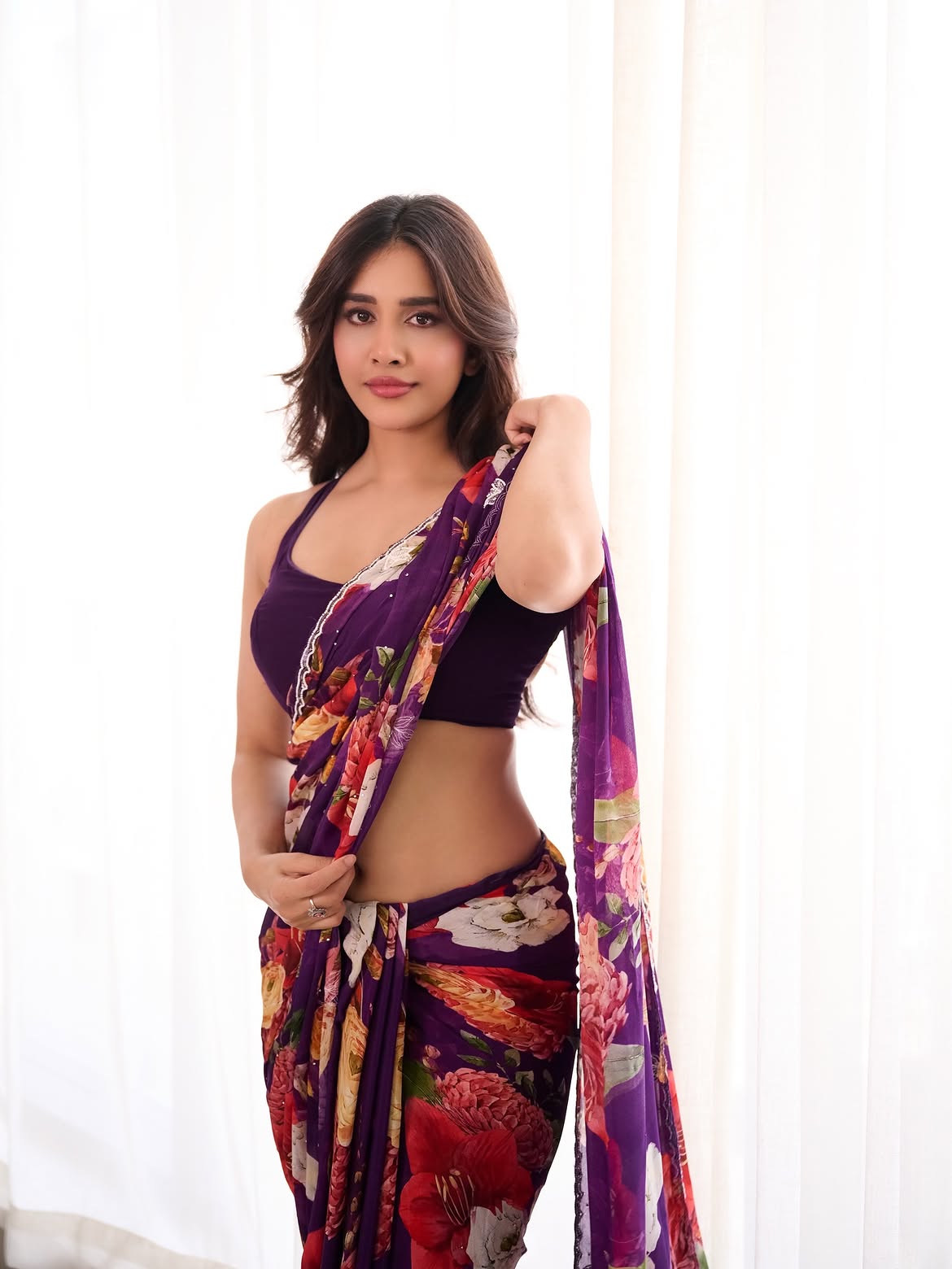Nabha Natesh Showing Off Navel In A Purple Saree