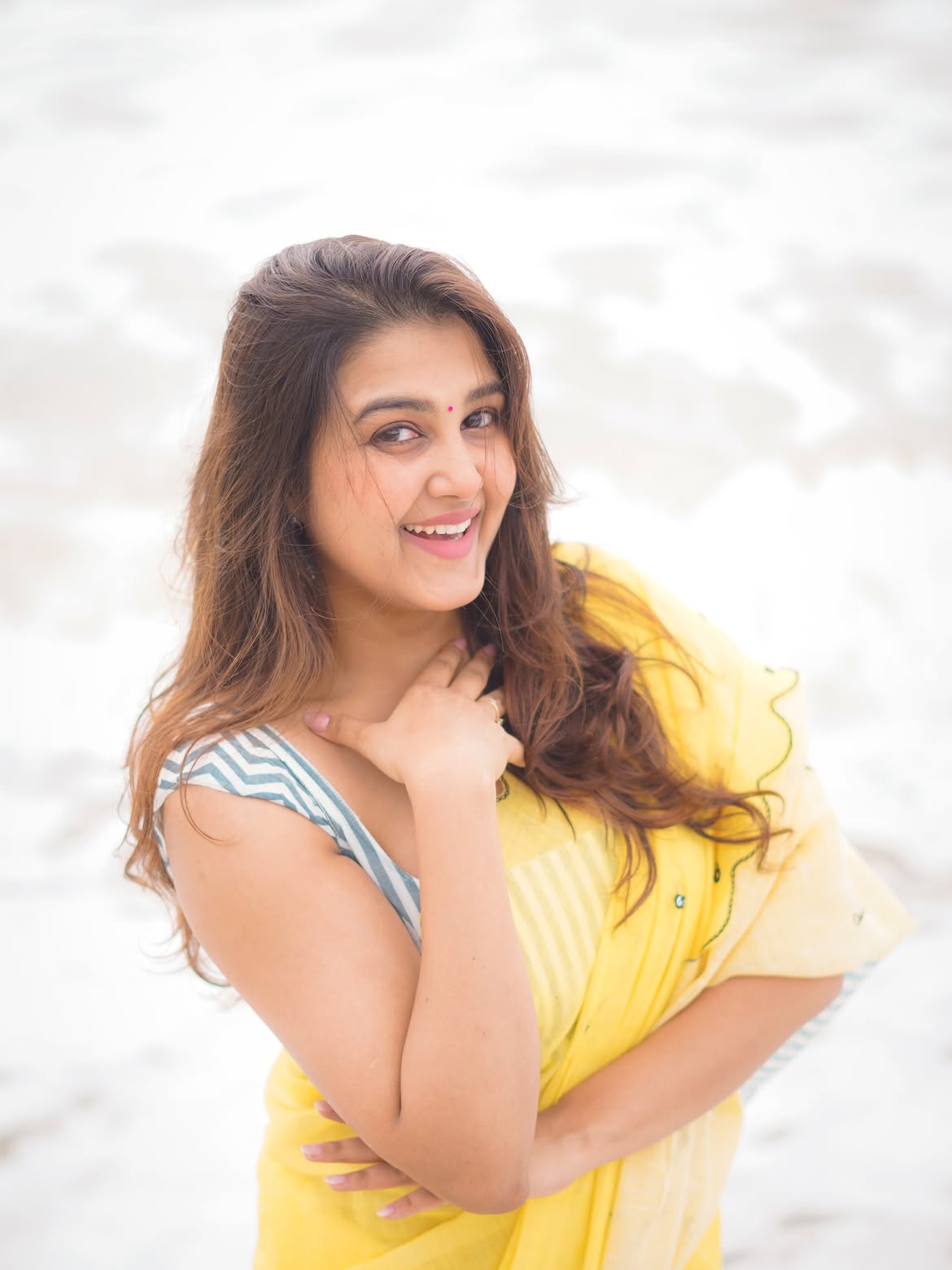 Sowmika Smiling Brightly In A Yellow Beach Saree
