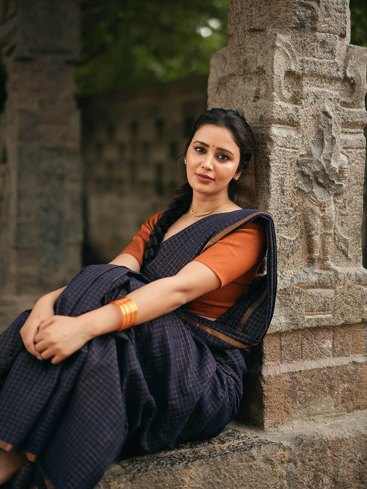 Anaira Gupta Gives A Side Glance By Stone Pillar