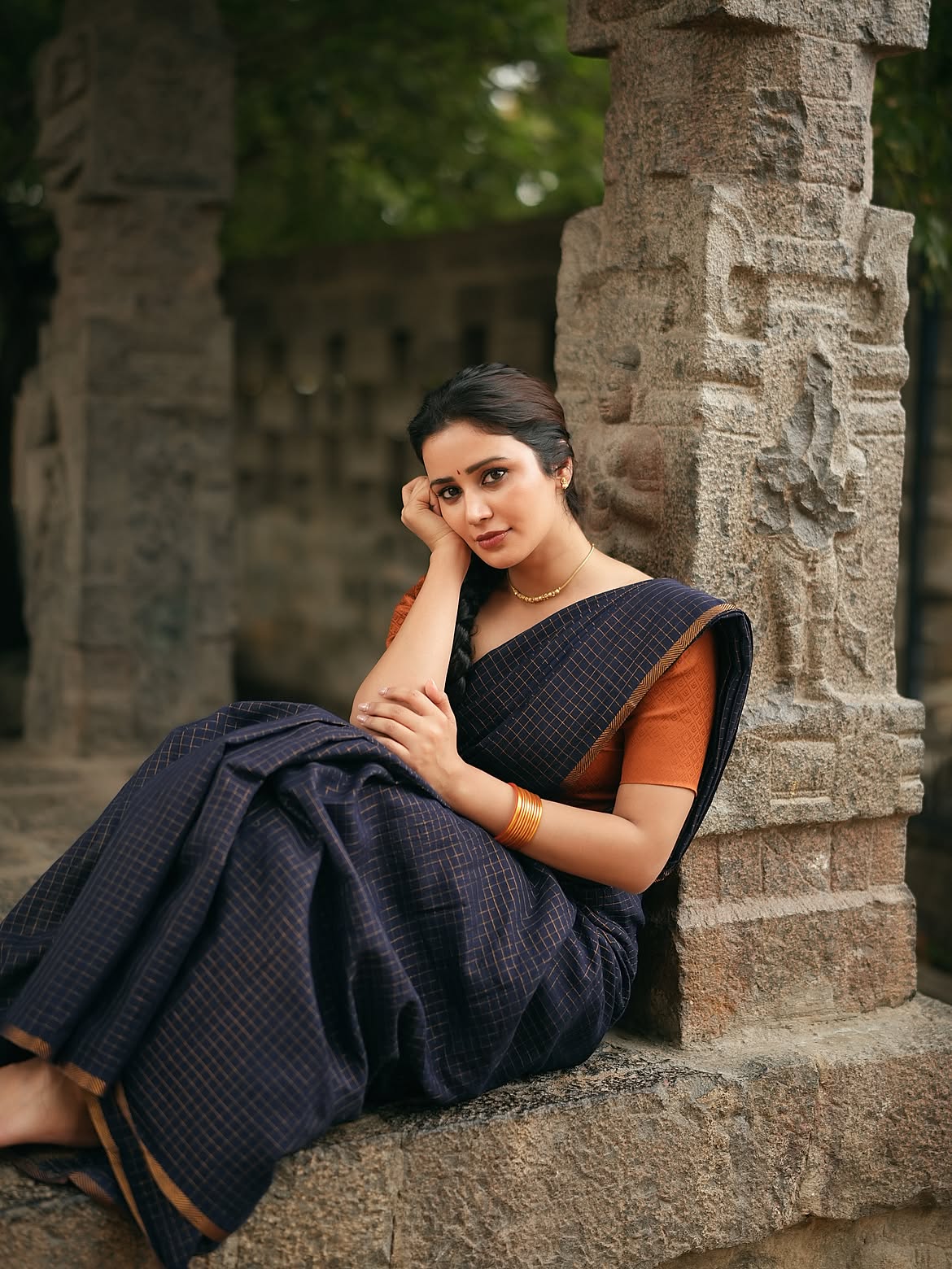 Anaira Gupta Sits Beside A Carved Stone Pillar!!
