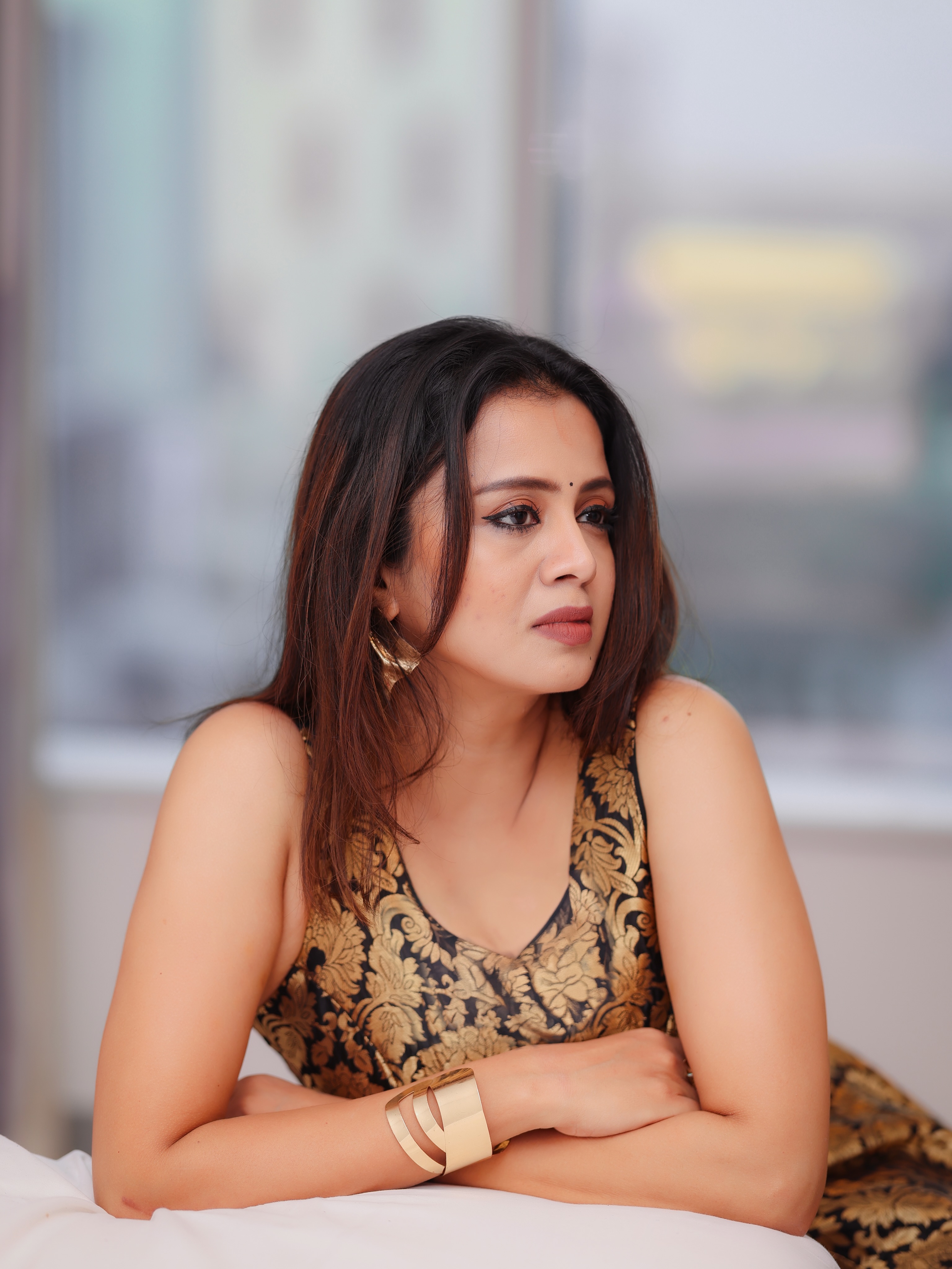 Anjana Rangan Looks Aside In A Gold Floral Dress