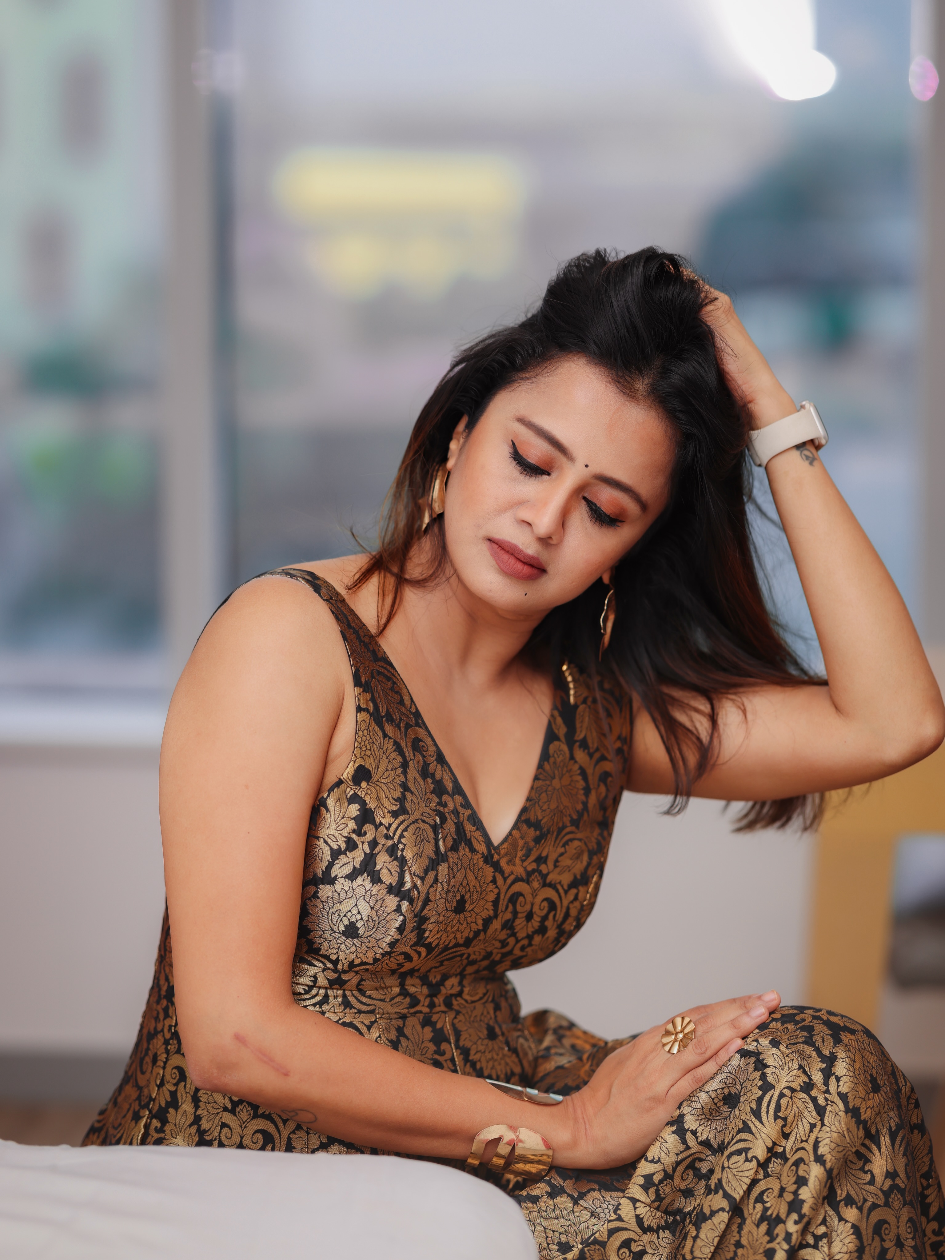 Anjana Rangan Looks Down While Holding Her Hair!