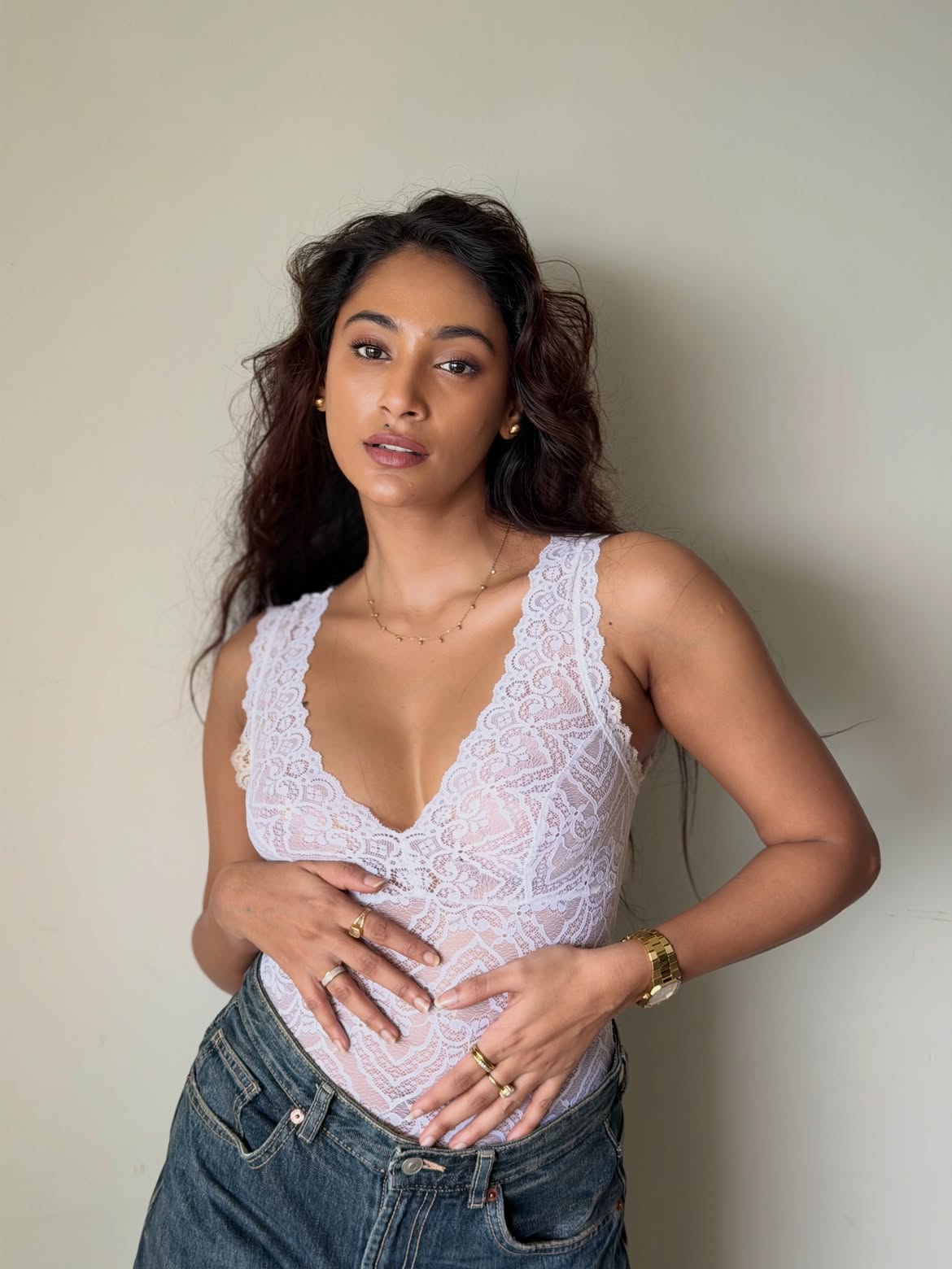 Anukreethy Vas Poses In White Lace And Raw Denim