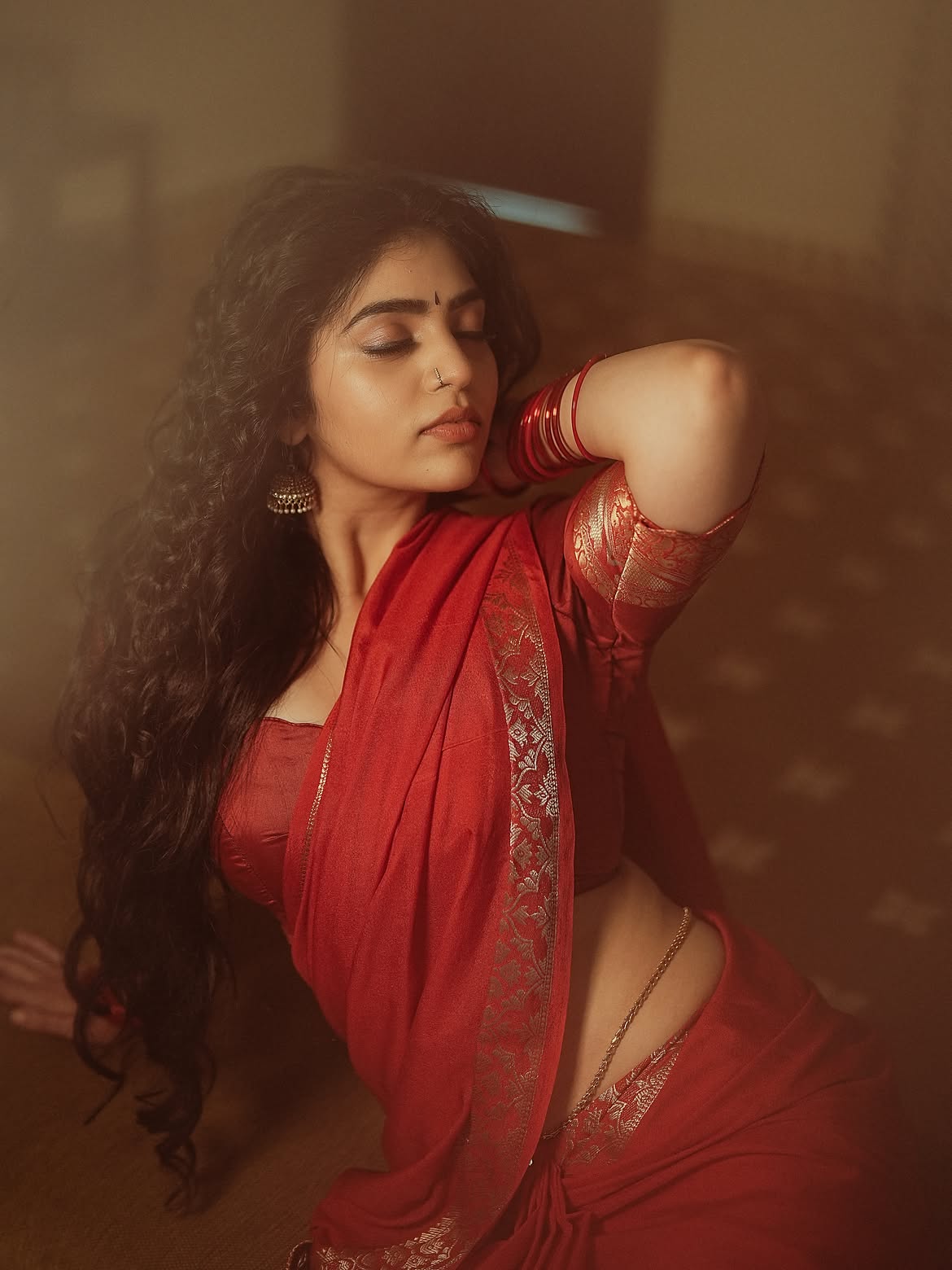 Bandhavi Sridhar Gives A Bold Gaze In Red Saree!