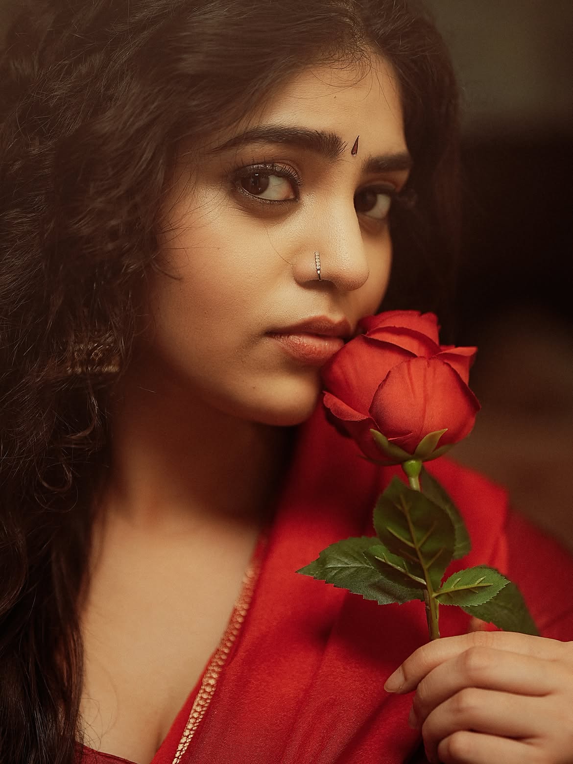 Bandhavi Sridhar Holds A Rose In Red Saree Glam!