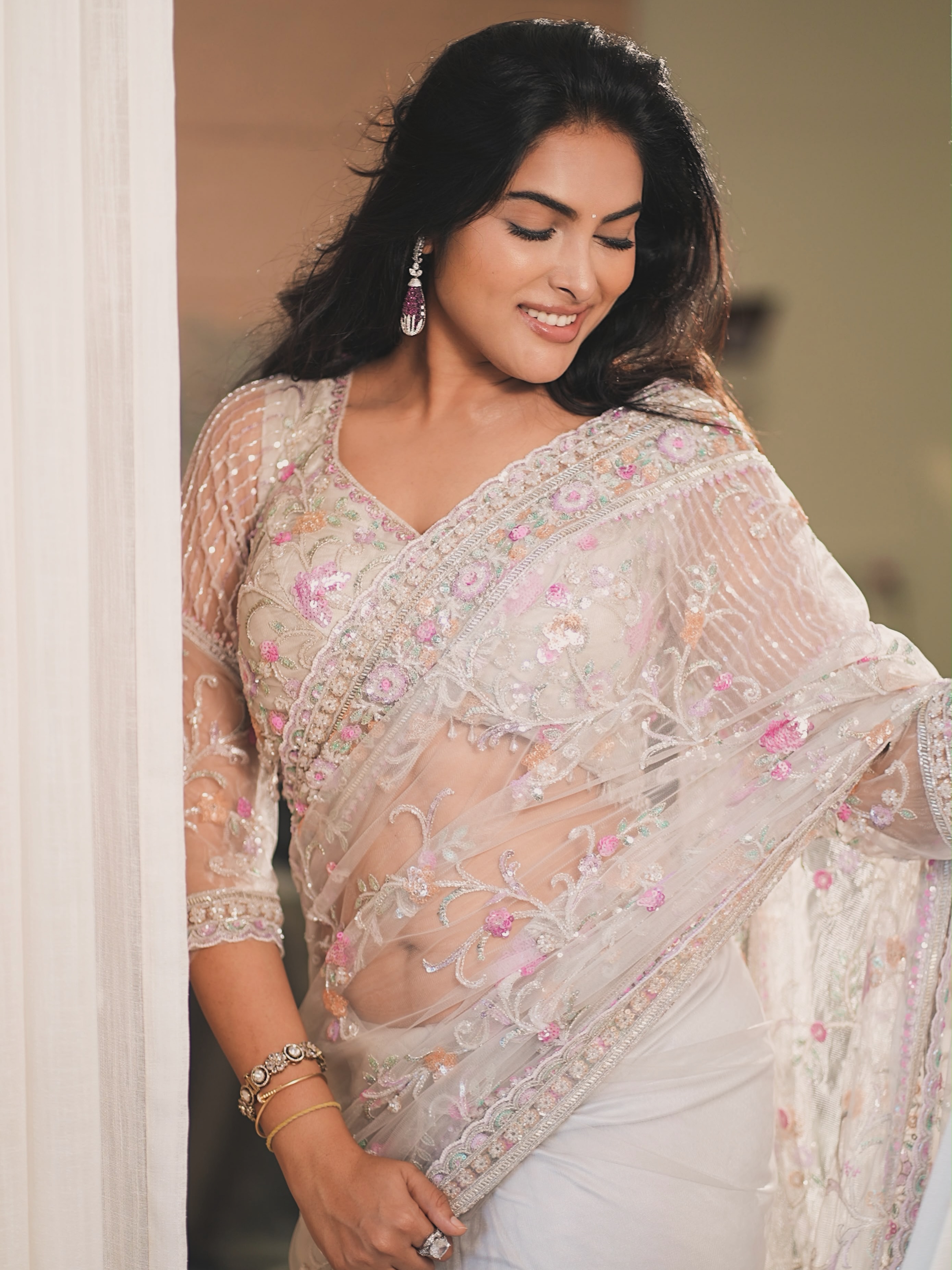 Divi Vadthya Looks Down At Her Floral Saree Hem!