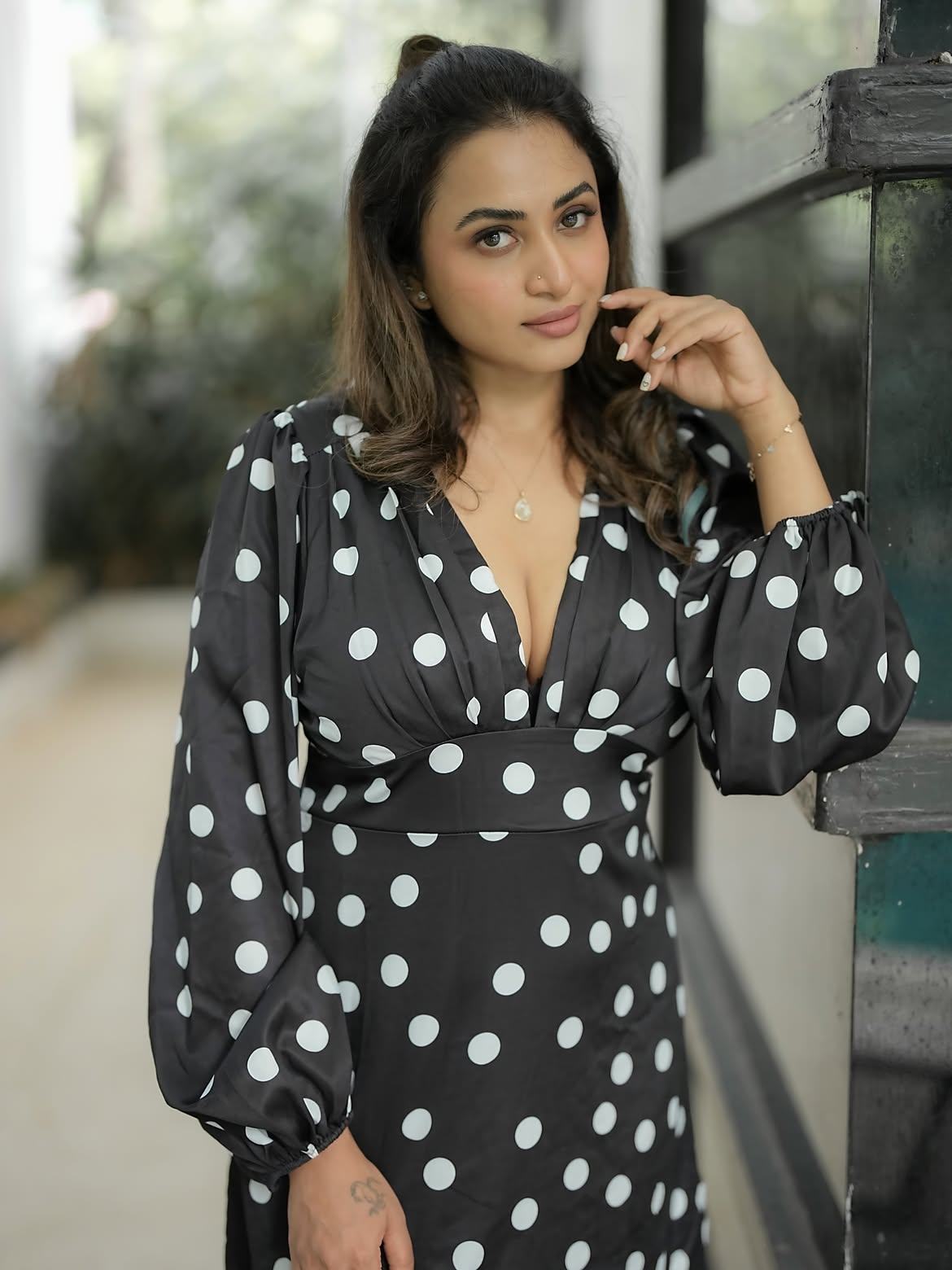 Janani Ashok Kumar Poses By A Dark Window Frame!