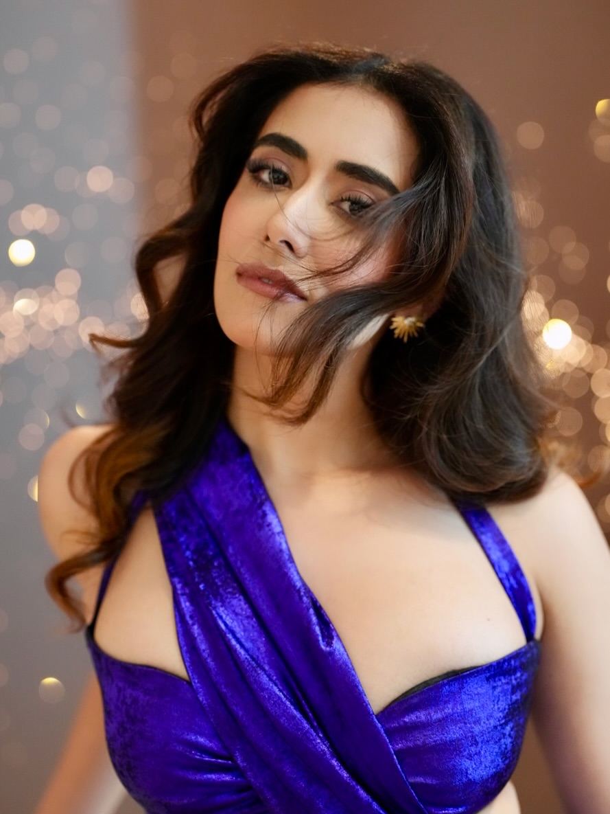 Jonita Gandhi Serves Purple Glam With Soft Curls
