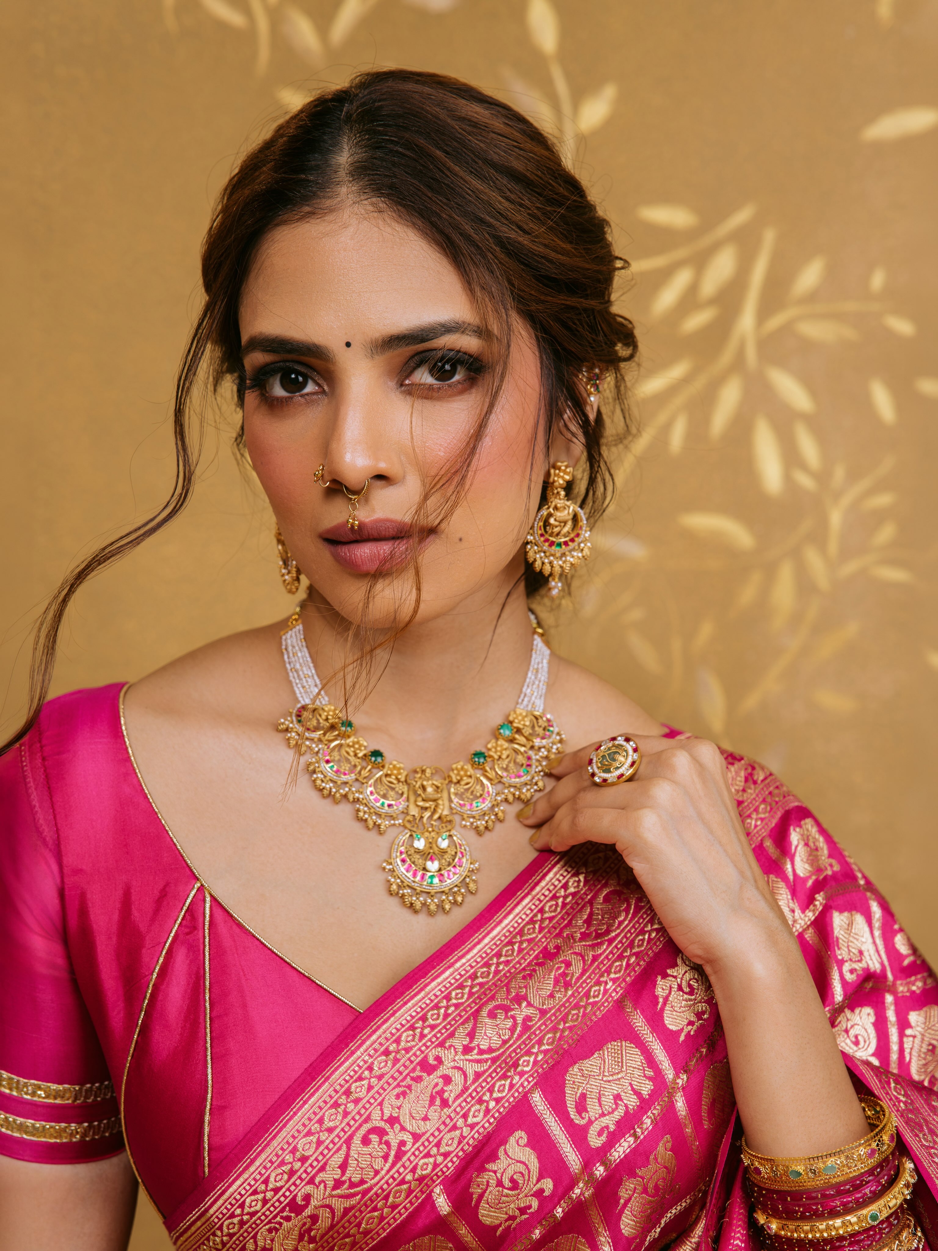 Malavika Mohanan Holds Her Ornate Gold Necklace!