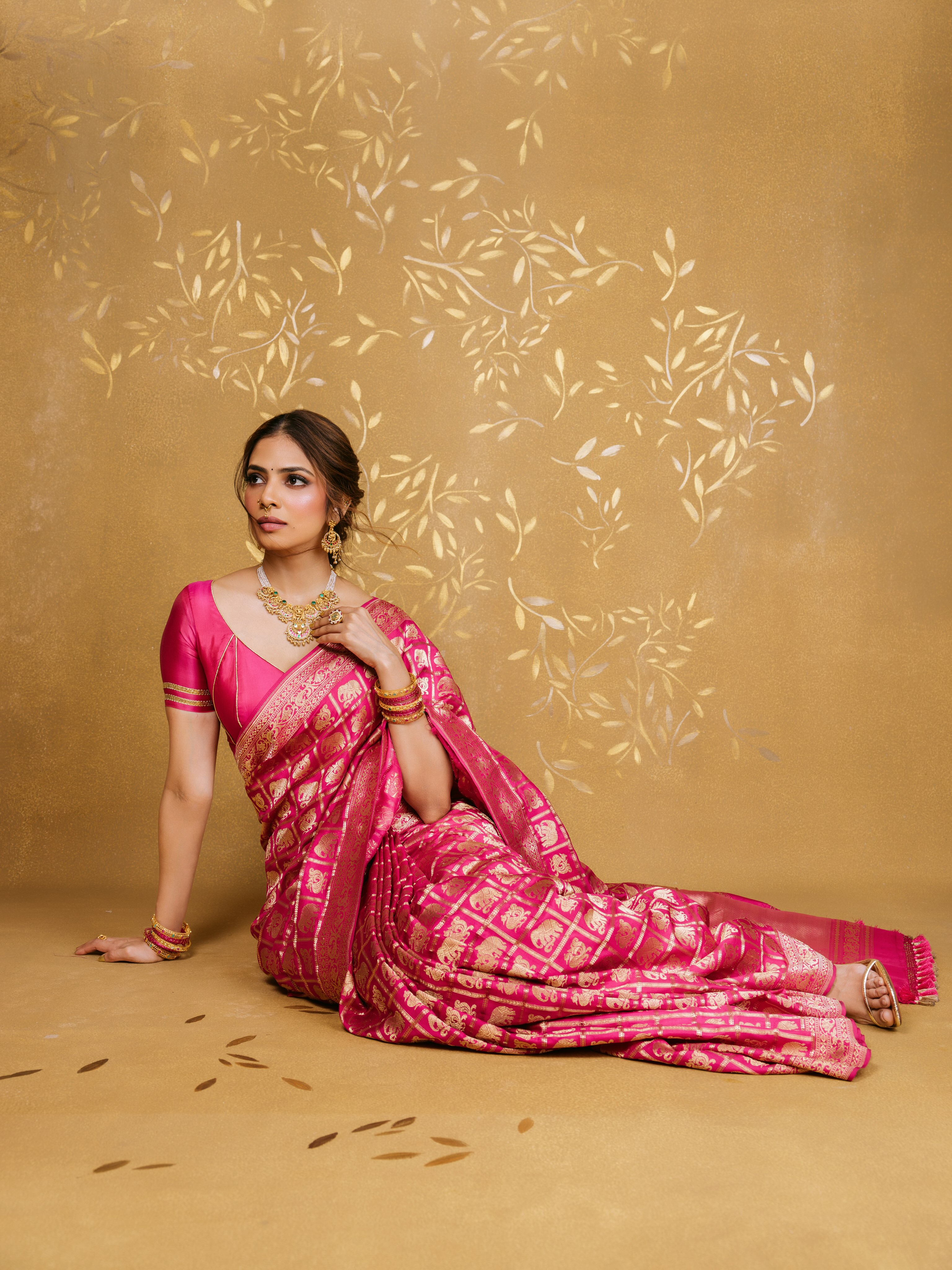 Malavika Mohanan Poses In Pink With Gold Bangles
